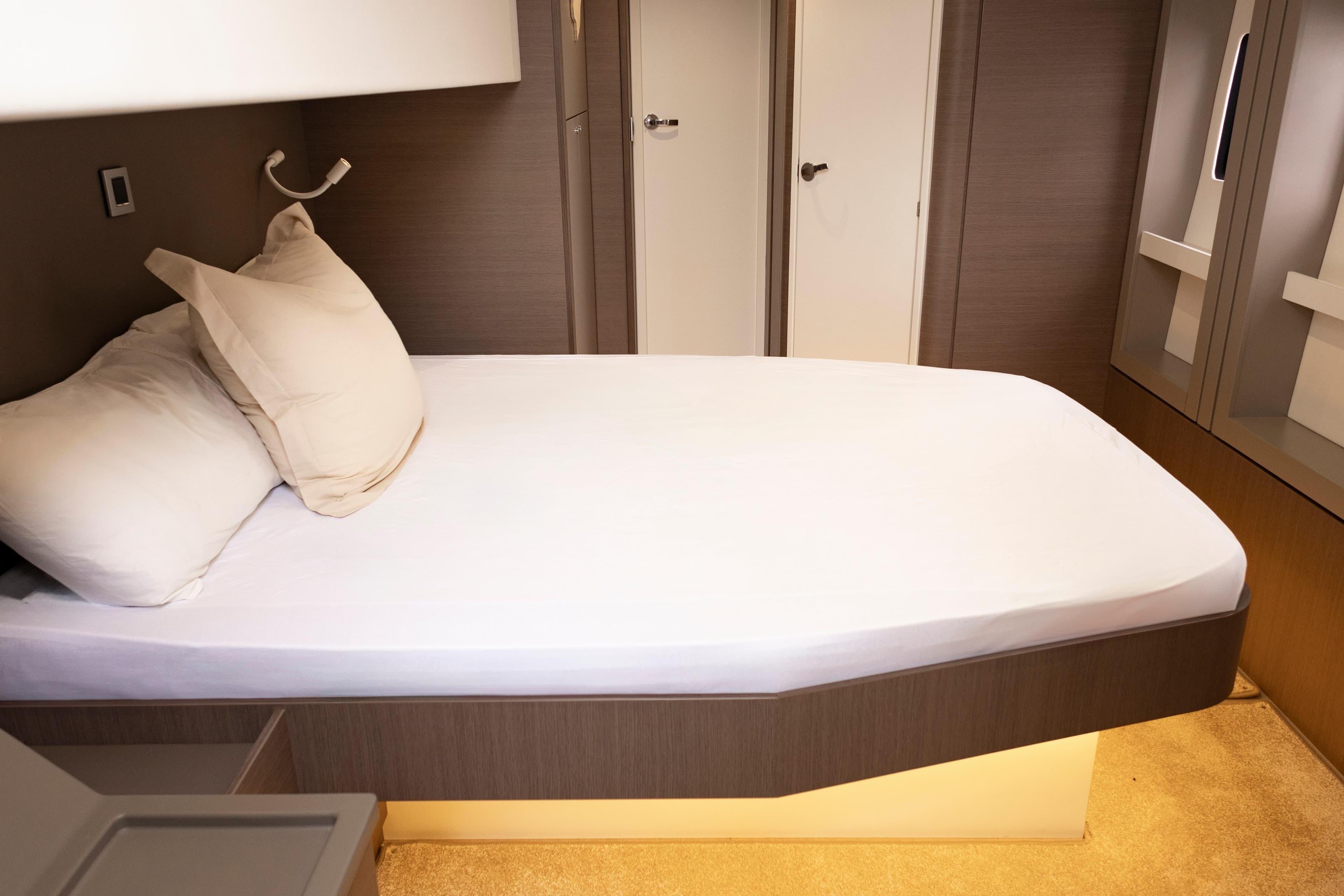 Modern cabin interior of 2020 Bali 4.8 yacht with cozy bed and ambient lighting.