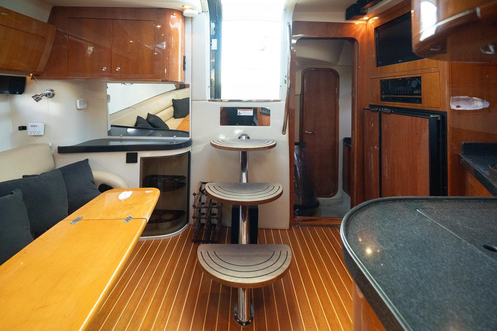 Interior of 2009 Regal Commodore 4060 yacht with wooden finishes and modern amenities.
