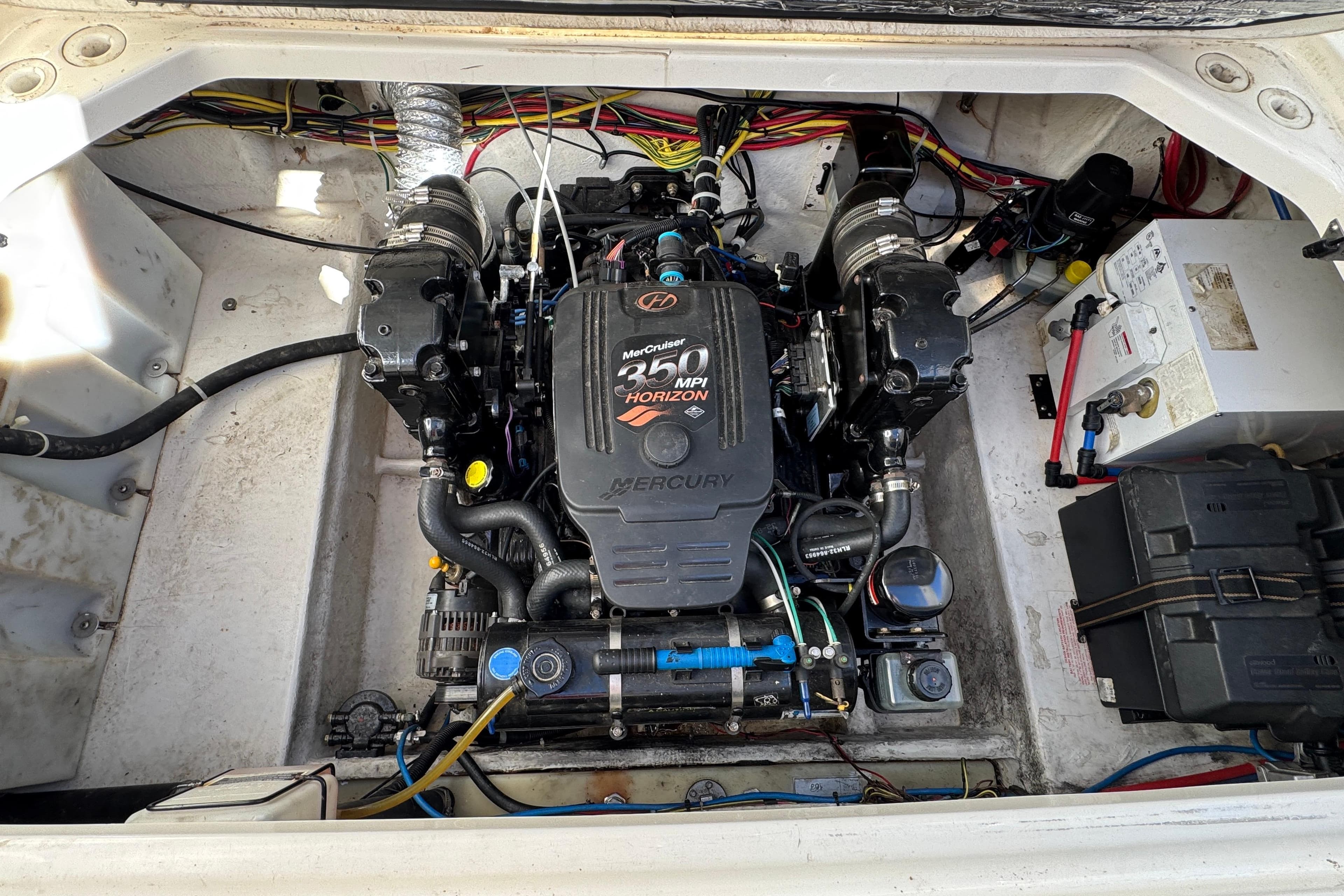Engine compartment of a 2007 Bayliner 285 boat with MerCruiser 350 MPI Horizon engine.