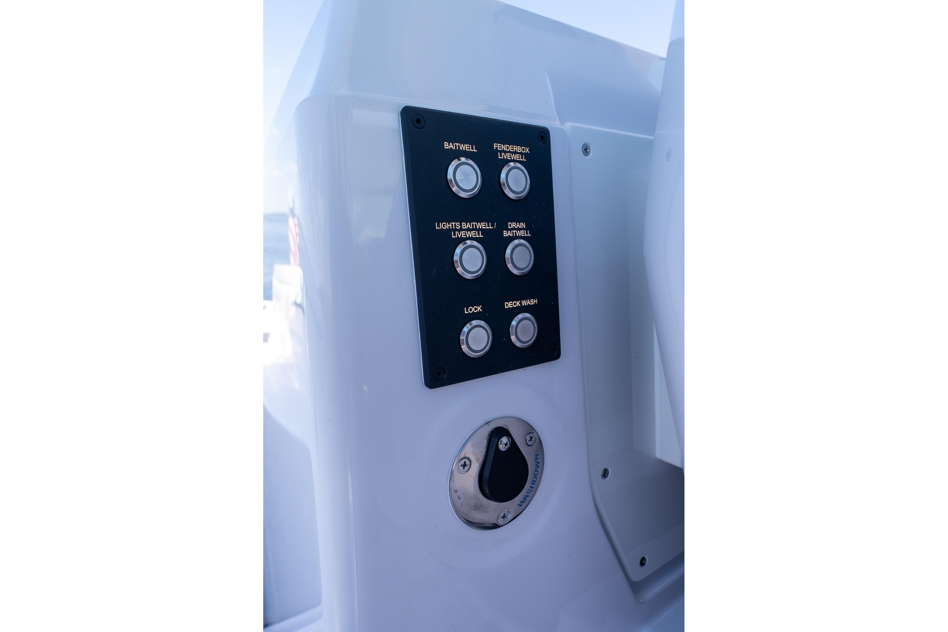 2025 Axopar CCX Center Console control panel with labeled buttons and switches.