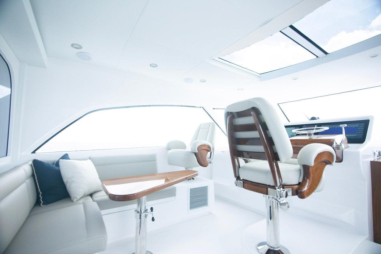 Manufacturer Provided Image: Luxurious interior of 2026 Bertram 50 Sport yacht with modern seating and sleek design.