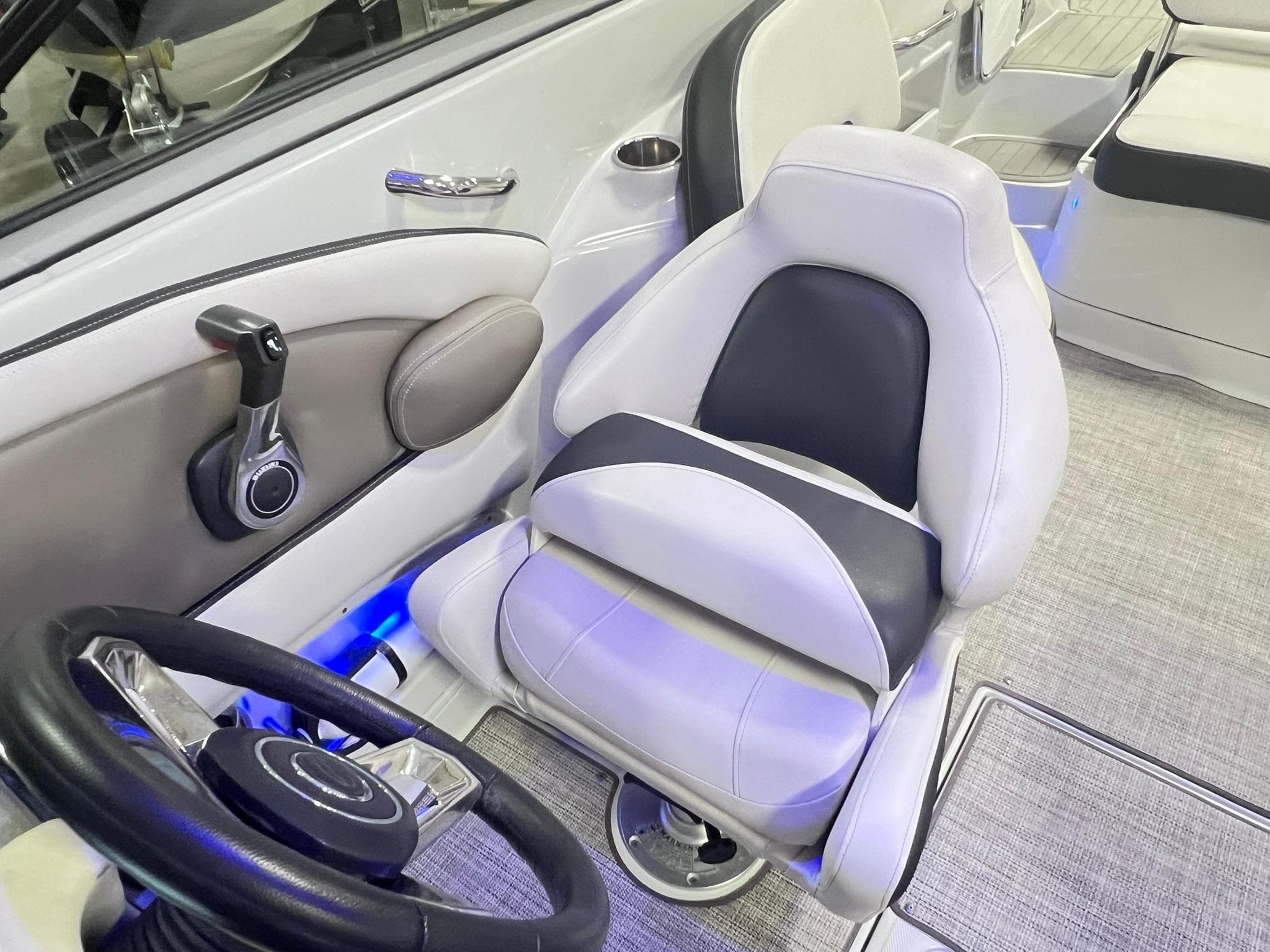 2020 Crownline Eclipse E225 XS boat interior with steering wheel and captain's seat.