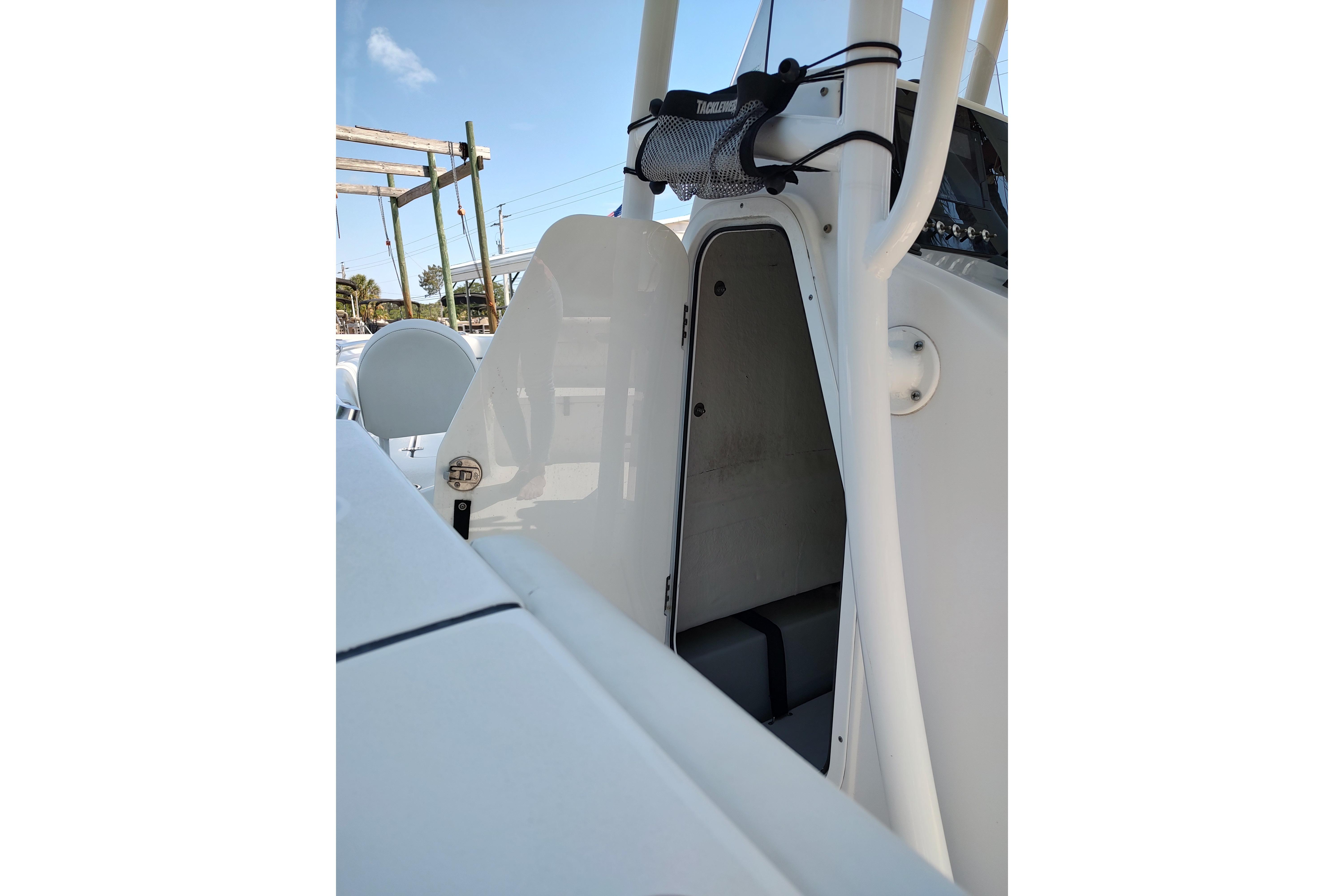 2020 Sportsman Heritage 211 Center Console boat interior with open storage compartment.