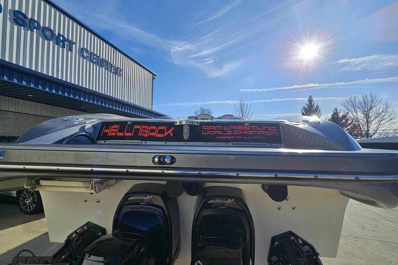 2007 Hustler 41 Razor boat at a sport center under a sunny sky.