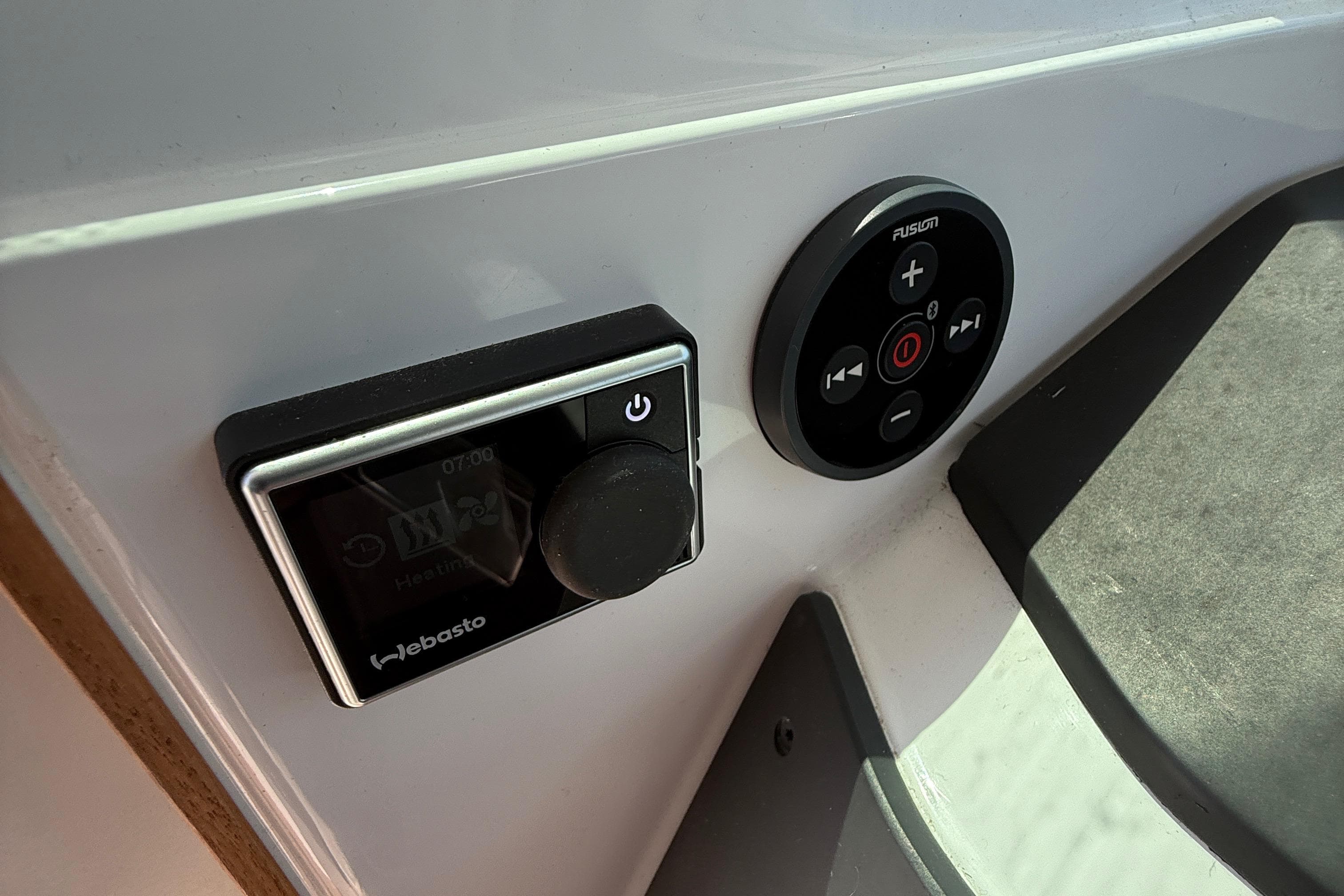 Control panel on 2021 Axopar 28 WetBar boat featuring Webasto and Fusion systems.