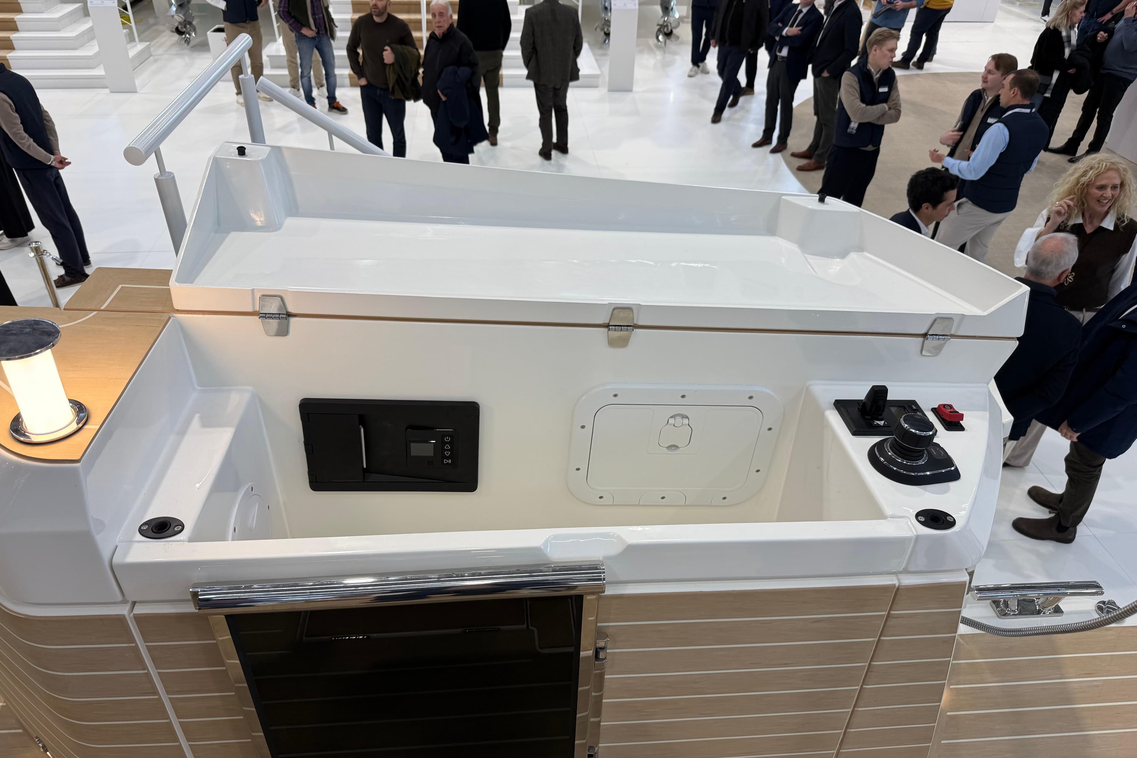 2026 Saxdor 460 GTC boat interior at a crowded exhibition, showcasing modern design features.