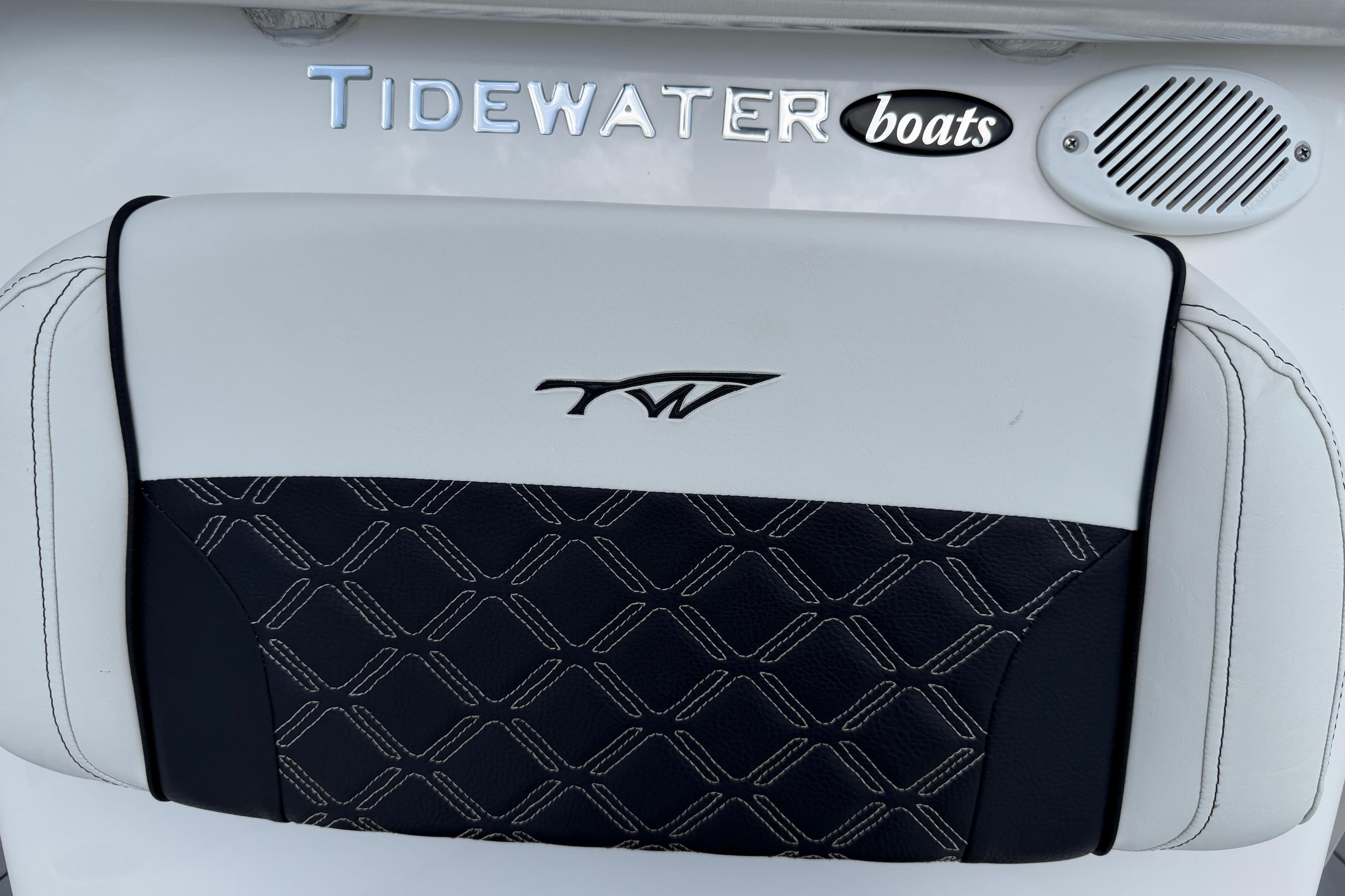 2023 Tidewater 198 CC Adventure boat seat with logo and speaker detail.