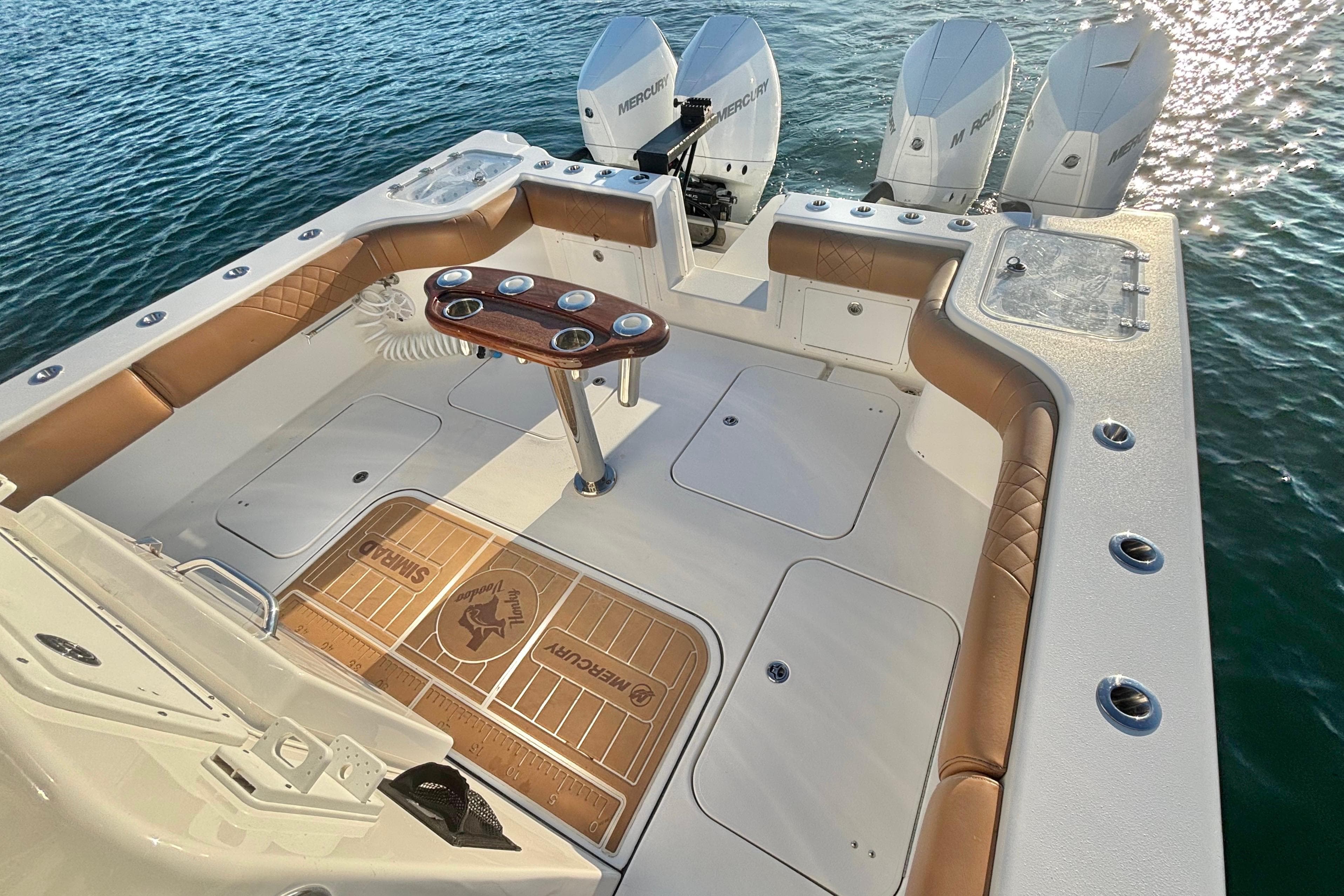 2022 Tideline 365 Offshore boat with triple Mercury engines, spacious deck, and luxurious seating.
