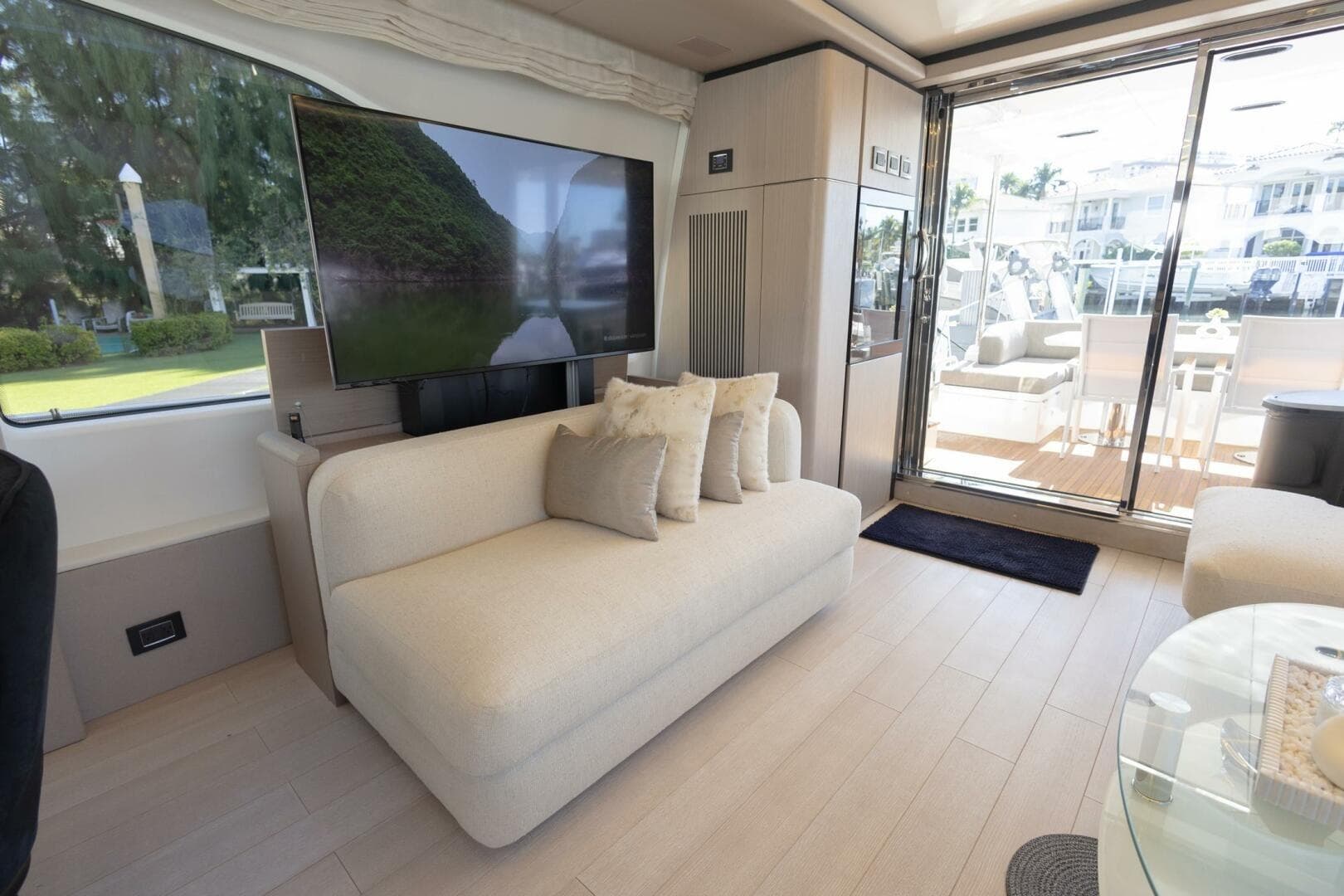 Luxurious interior of 2021 Azimut Fly 72 yacht with modern decor and large windows.