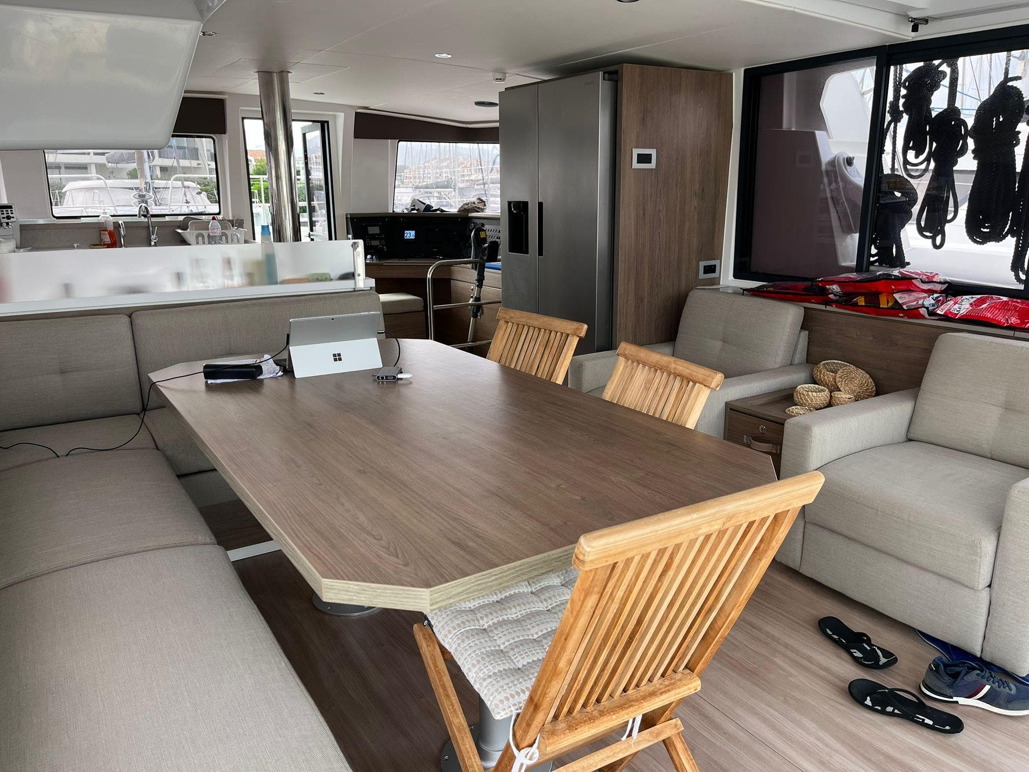 Modern interior of 2023 Bali 4.4 yacht with dining area and lounge seating.