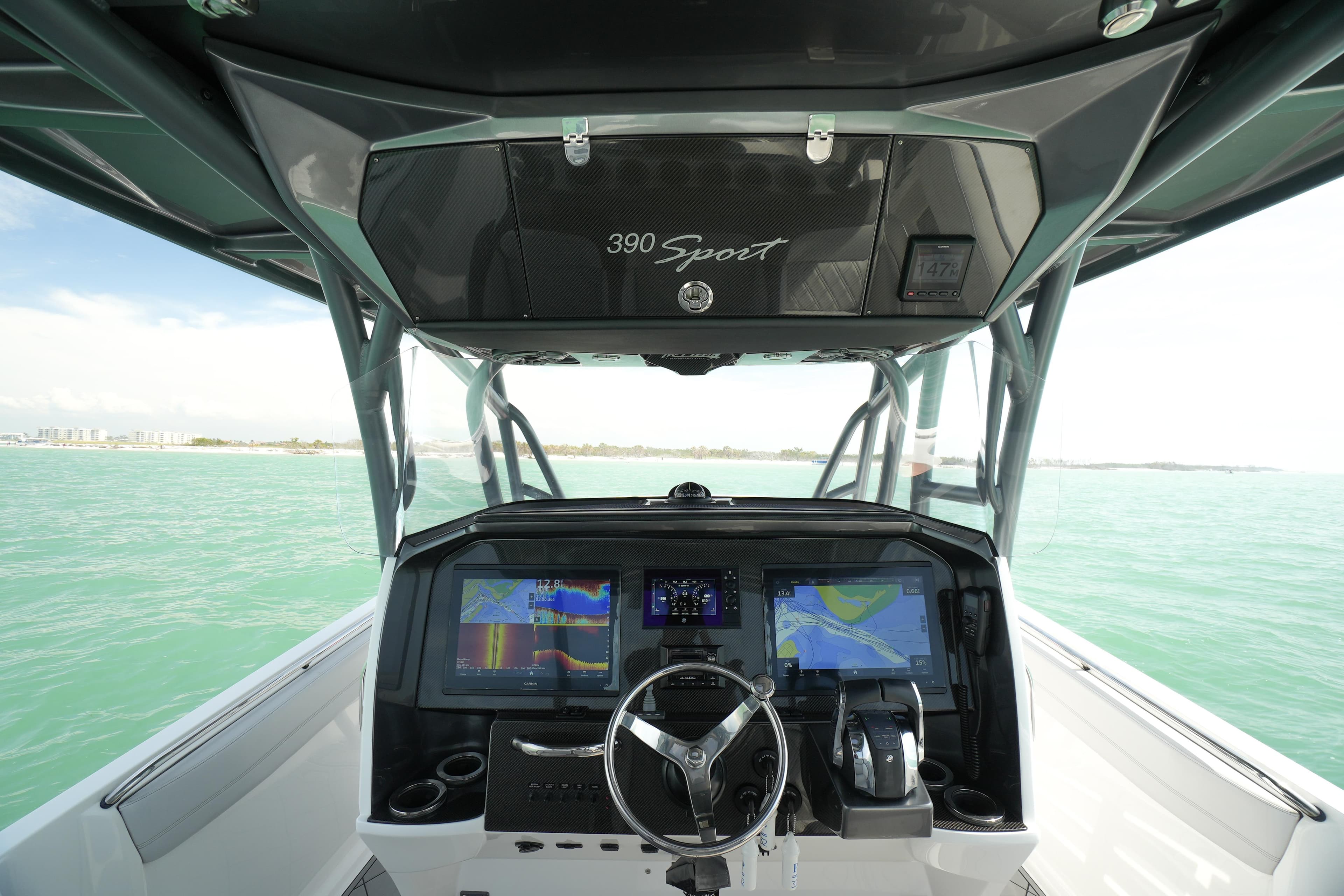 2020 Nor-Tech 390 Sport Center Console dashboard with advanced navigation systems on open water.