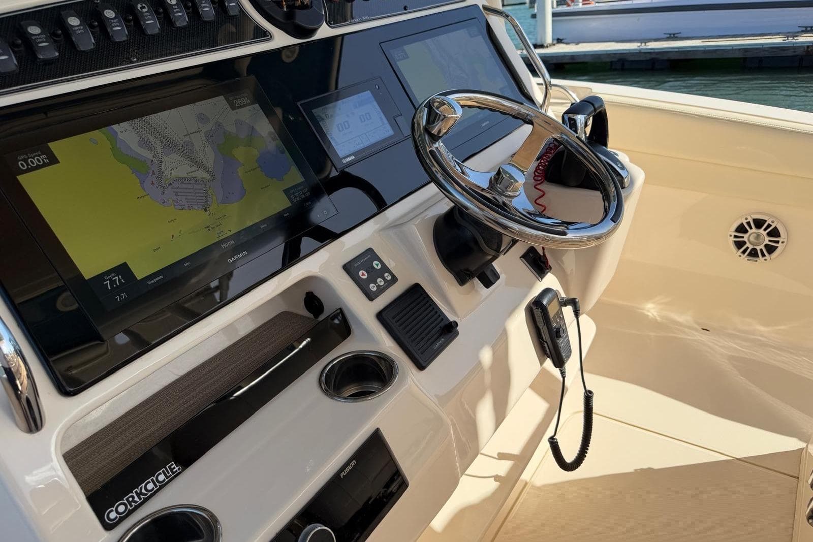 2021 Grady-White Canyon 326 helm with Garmin navigation and steering wheel.