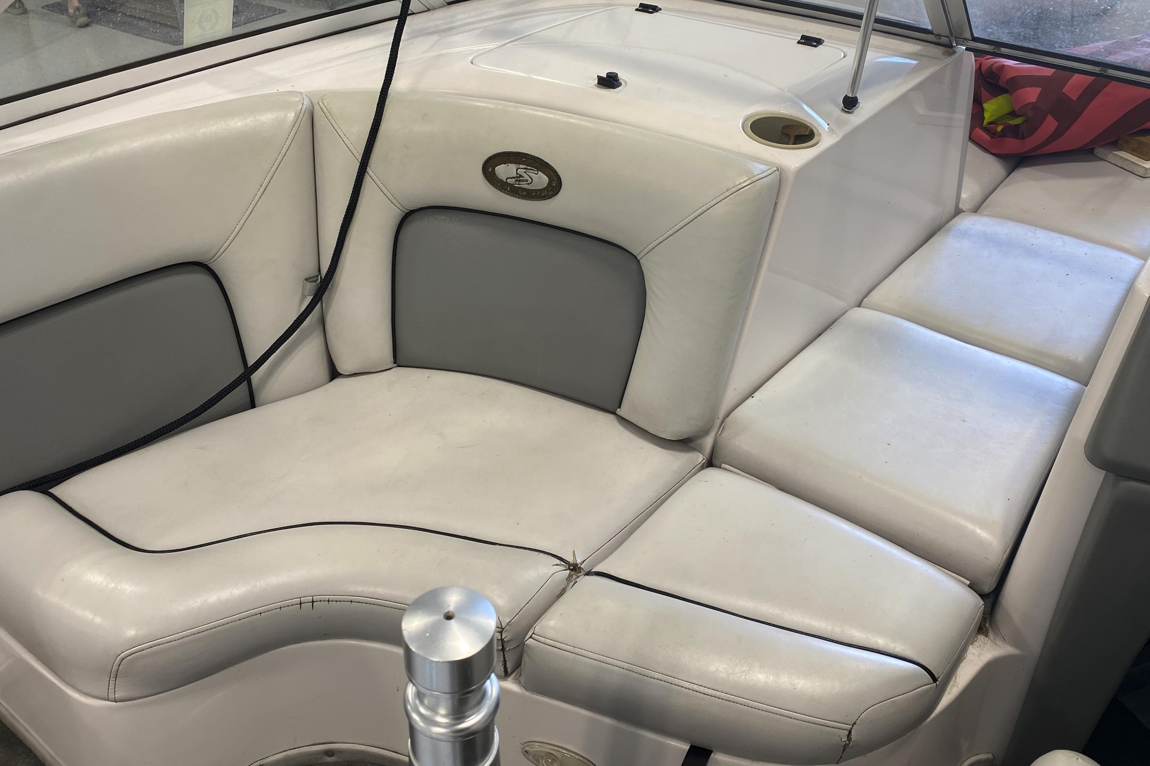 2002 Supra Sunsport 22' boat interior with white and gray seating.