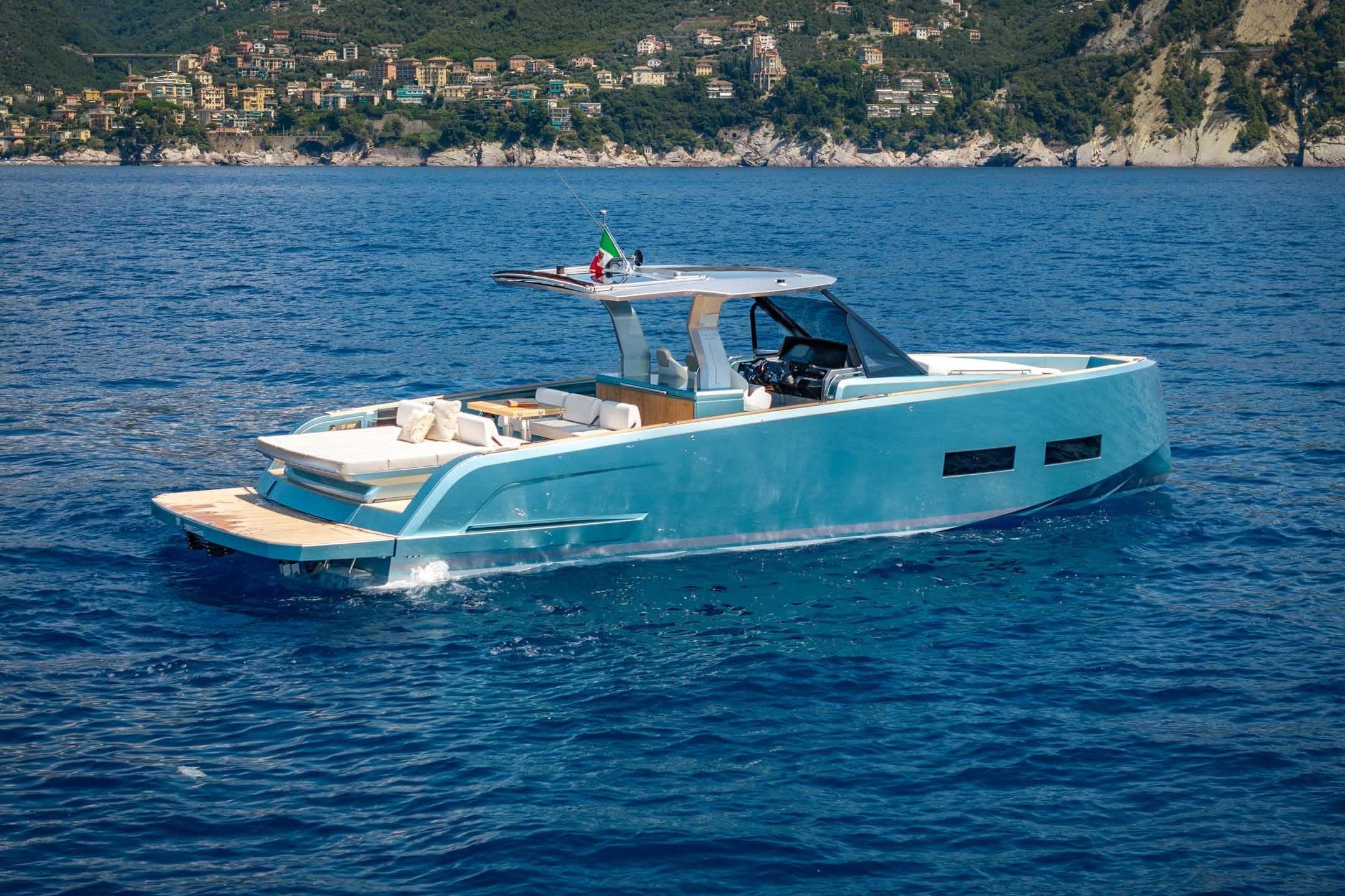 2026 Pardo Yachts P43 cruising on blue ocean near scenic coastline.