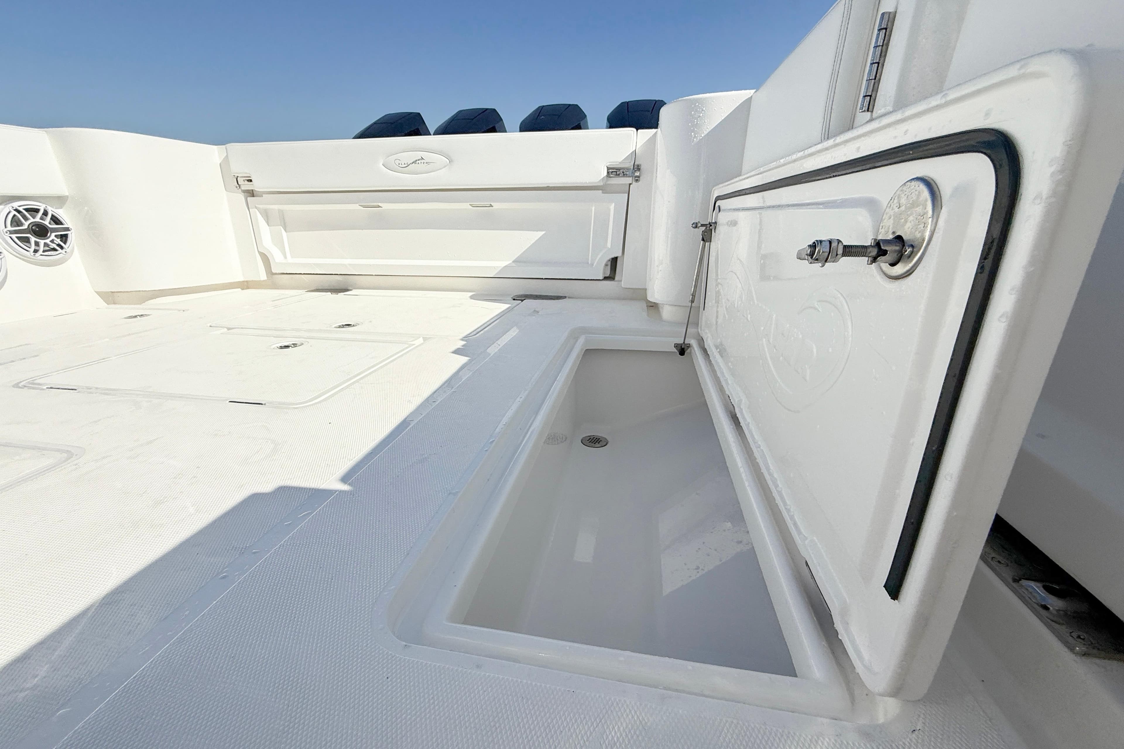2026 Blackwater 41 Sportfish boat deck with open storage compartment.