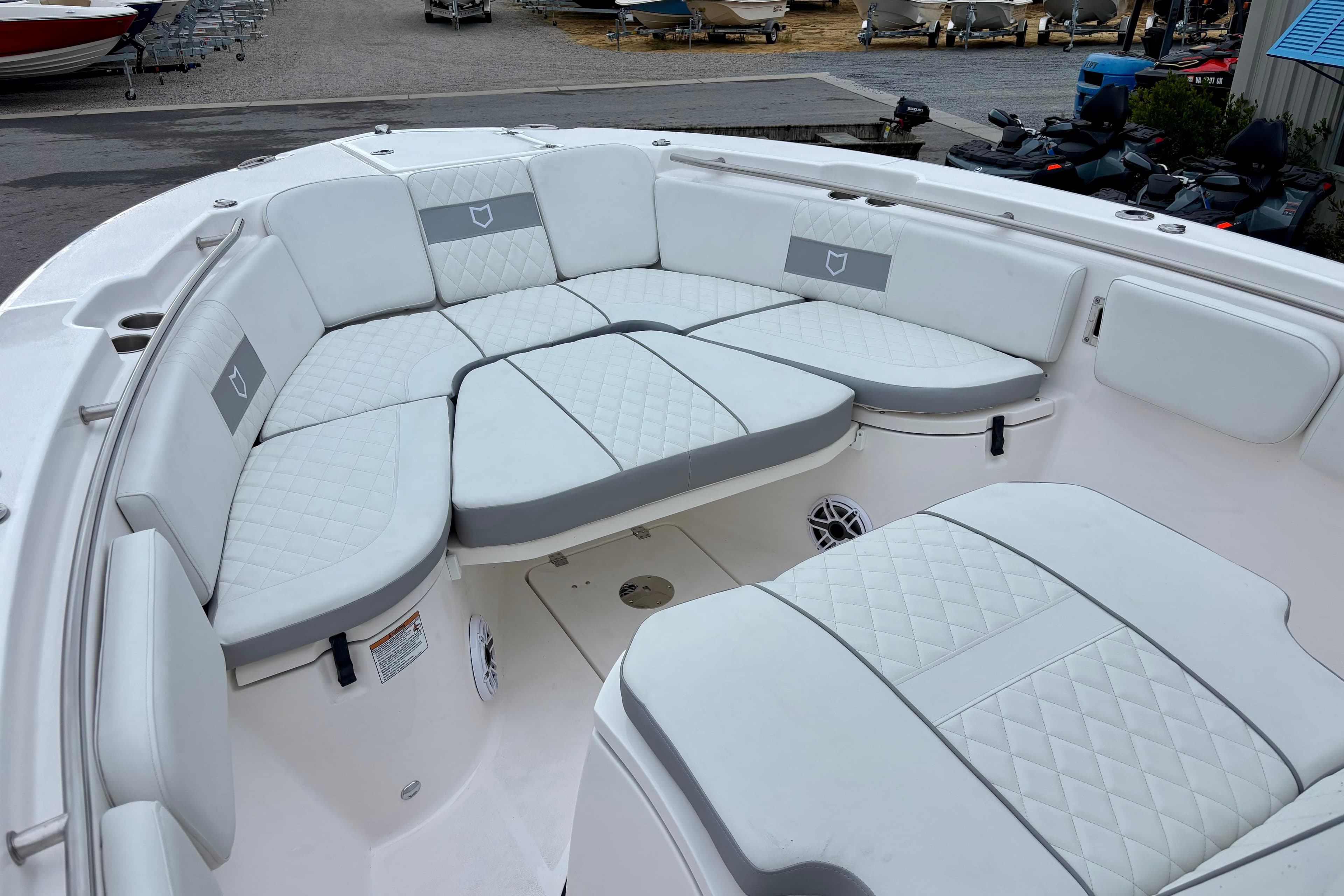 2026 Sea Fox 288 Commander boat with luxurious white seating and quilted upholstery.