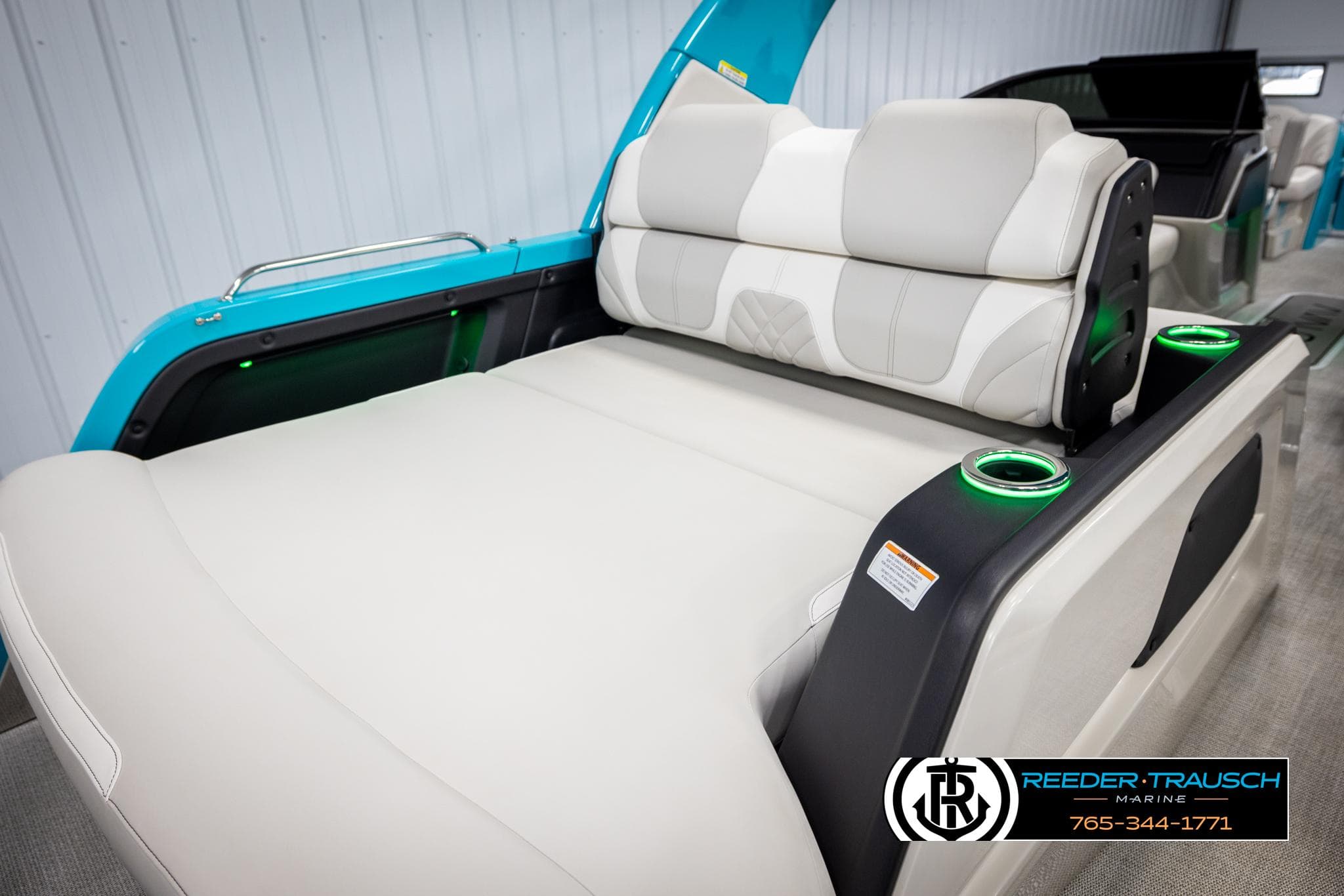 2025 Avalon 2585 Excal VRBW boat interior with luxurious seating and cup holders.