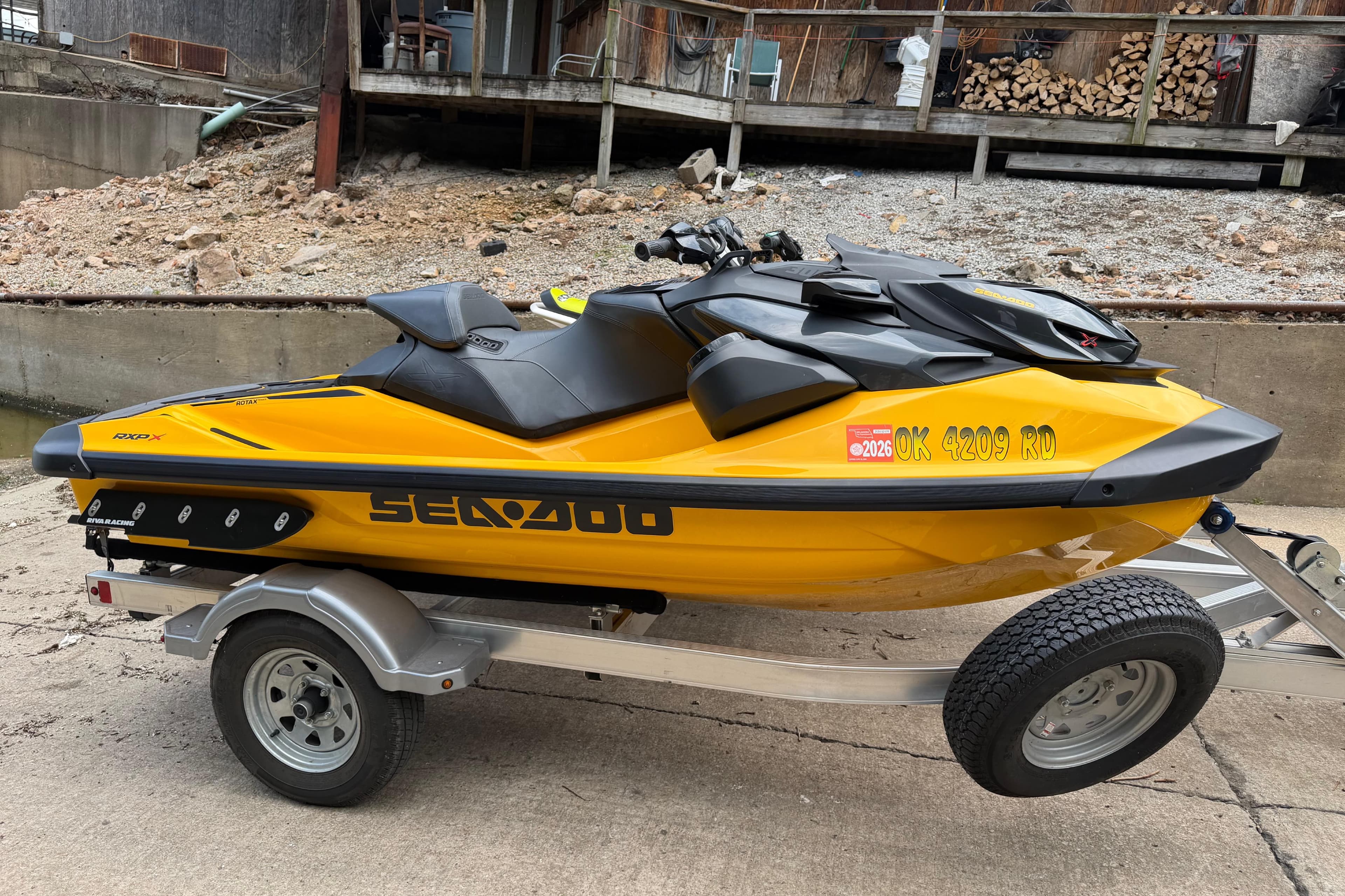 2021 Sea-Doo RXP-X 300 jet ski on trailer, yellow and black design.