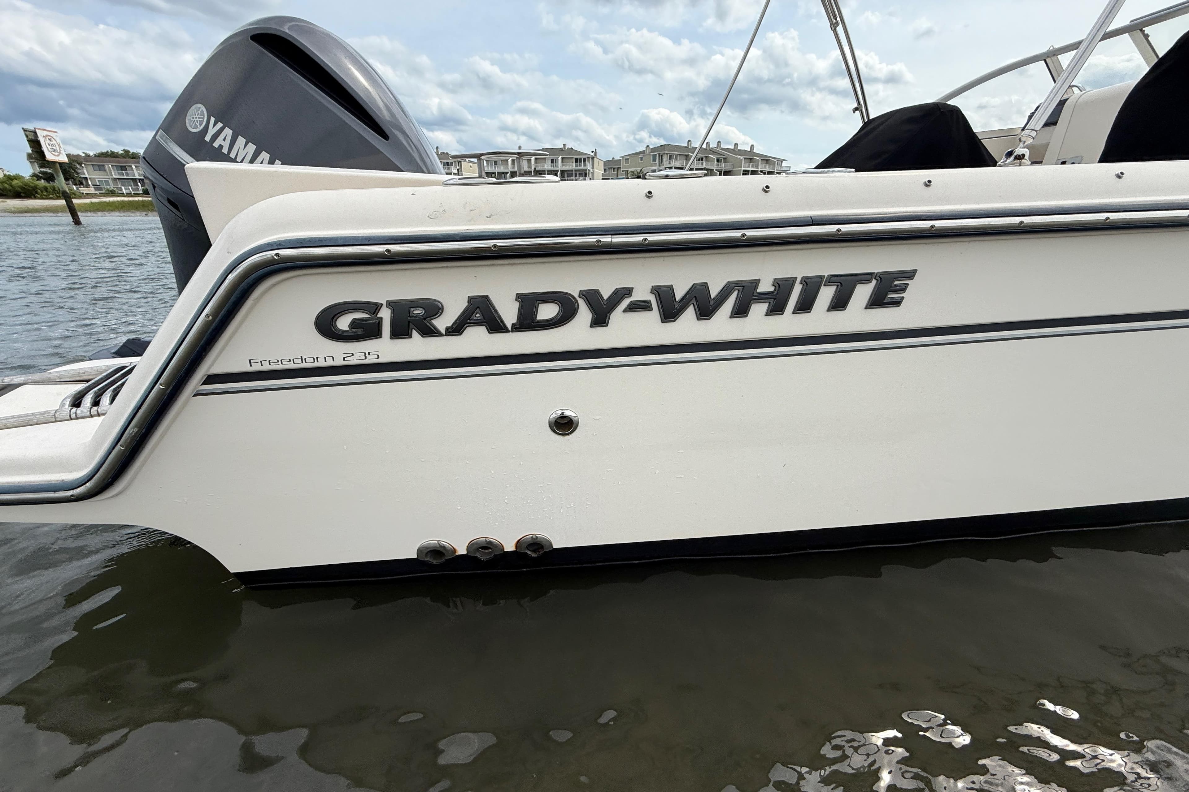 2017 Grady-White Freedom 235 boat on water, featuring Yamaha engine.