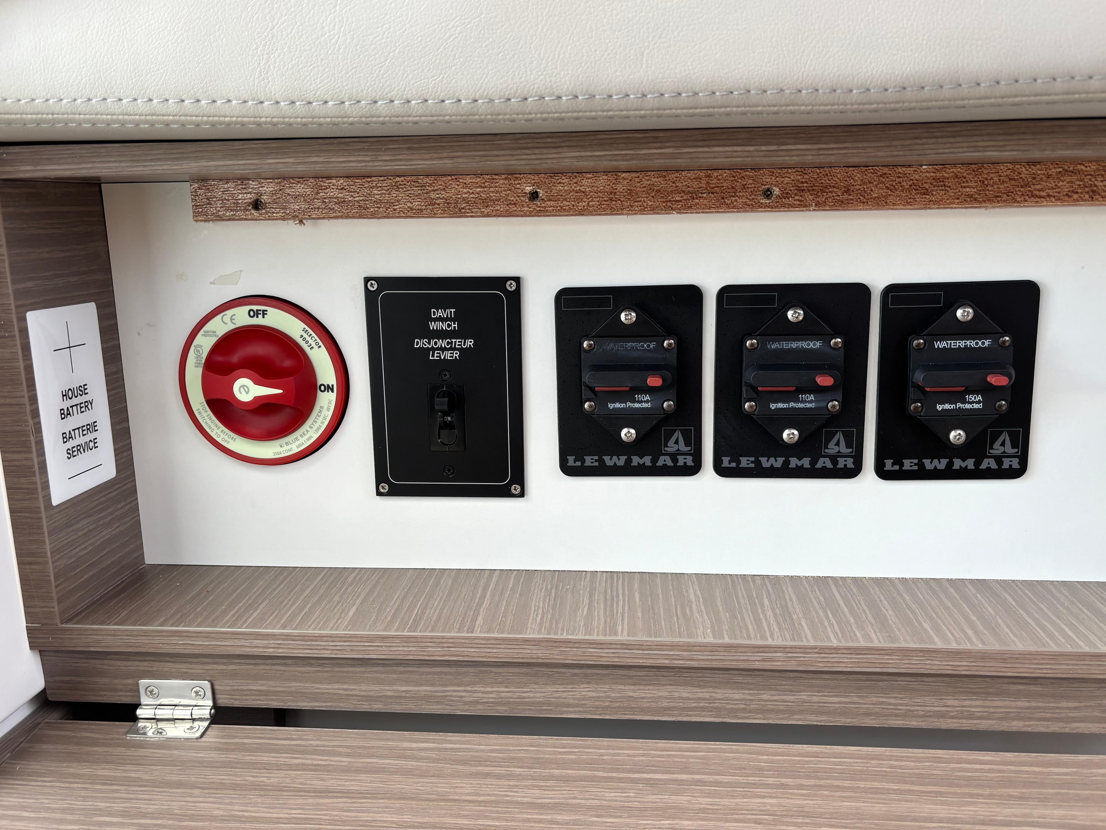 Control panel on Leopard 42 yacht, featuring battery switches and Lewmar waterproof circuit breakers.