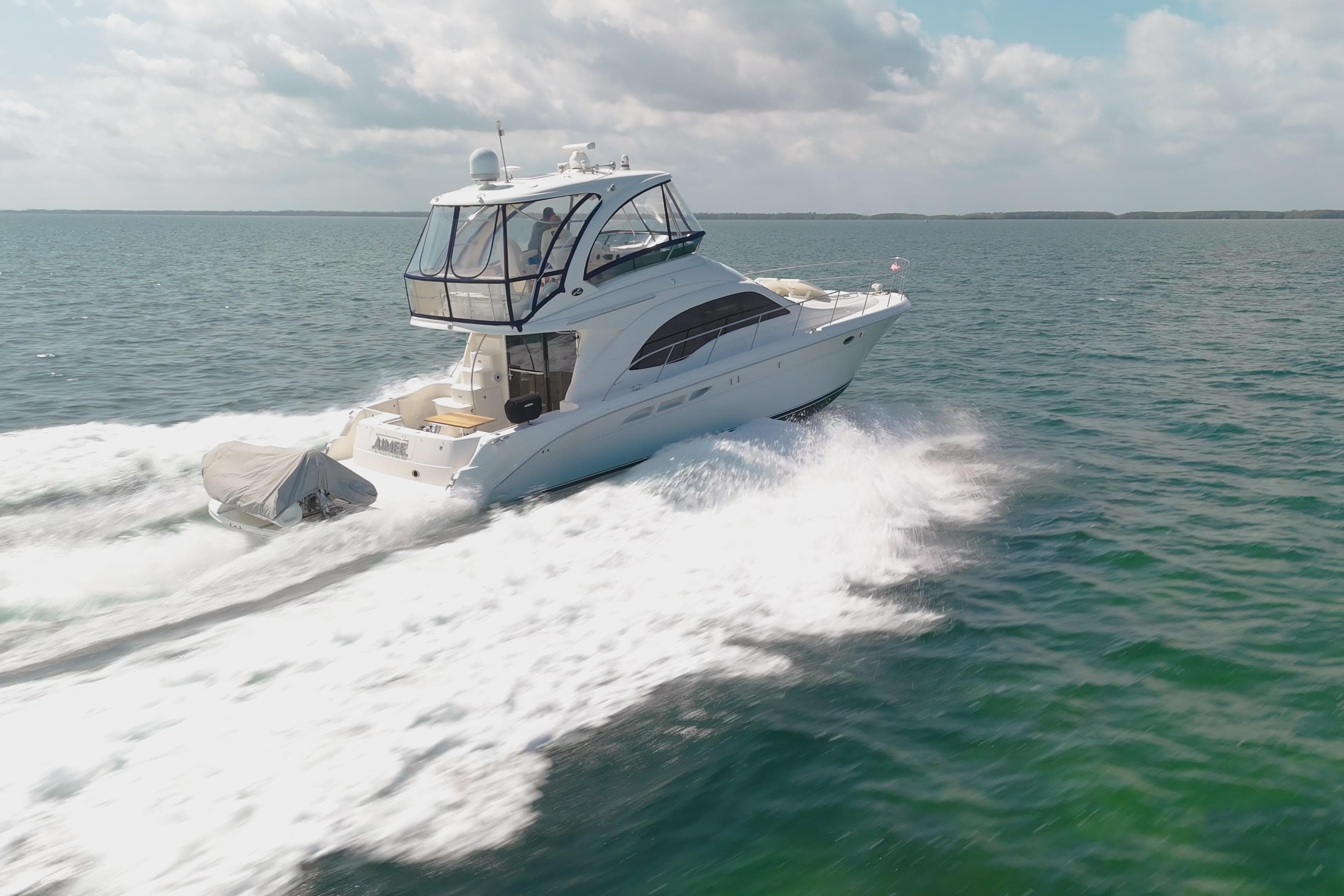 2008 Sea Ray 520 Sedan Bridge yacht cruising on open water.