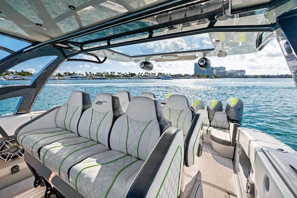 Luxurious 2022 Midnight Express 43' Solstice boat interior with plush seating on open water.
