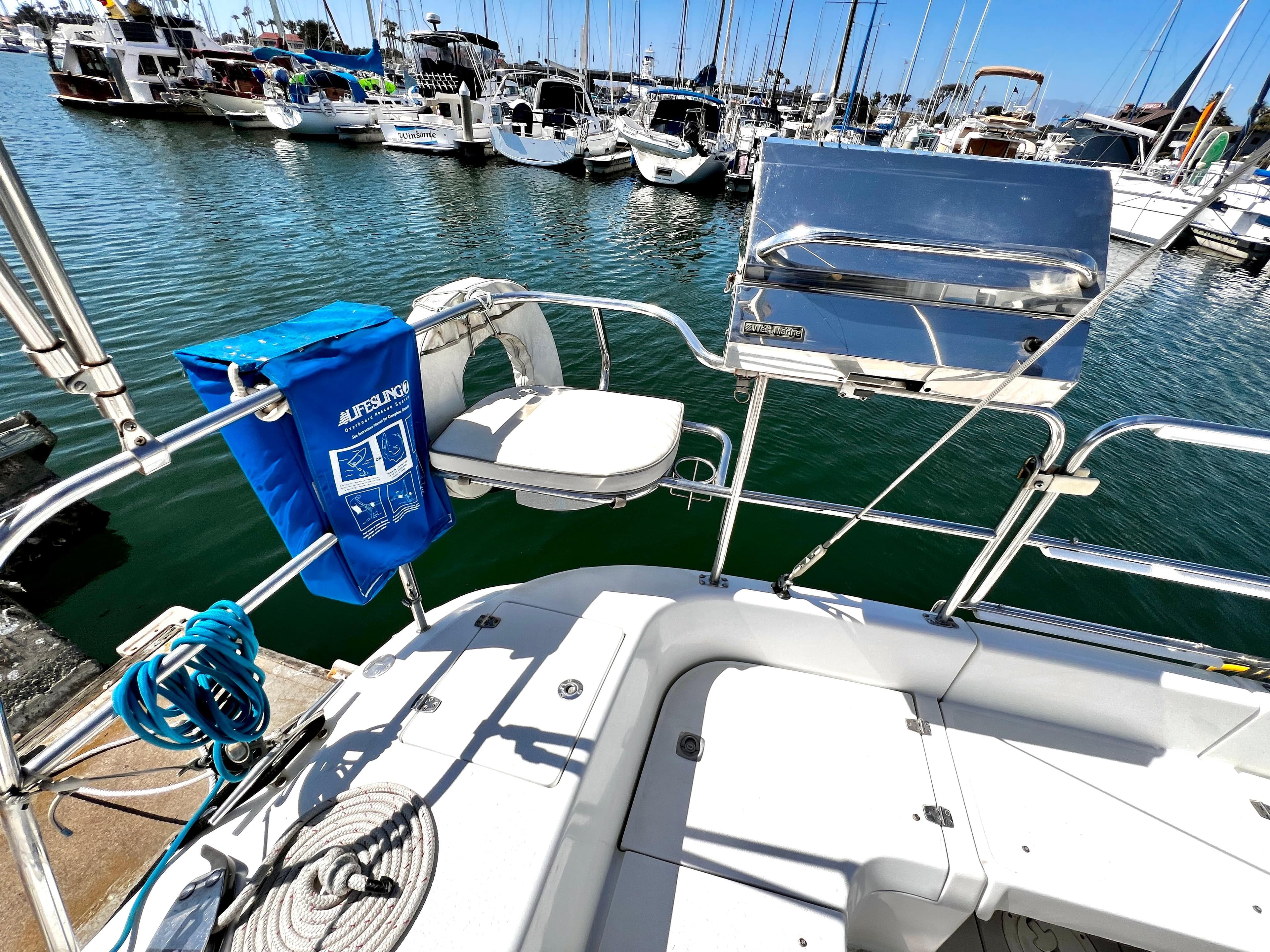 Catalina 350 sailboat deck with lifesaving equipment and marina view, 2007 model.