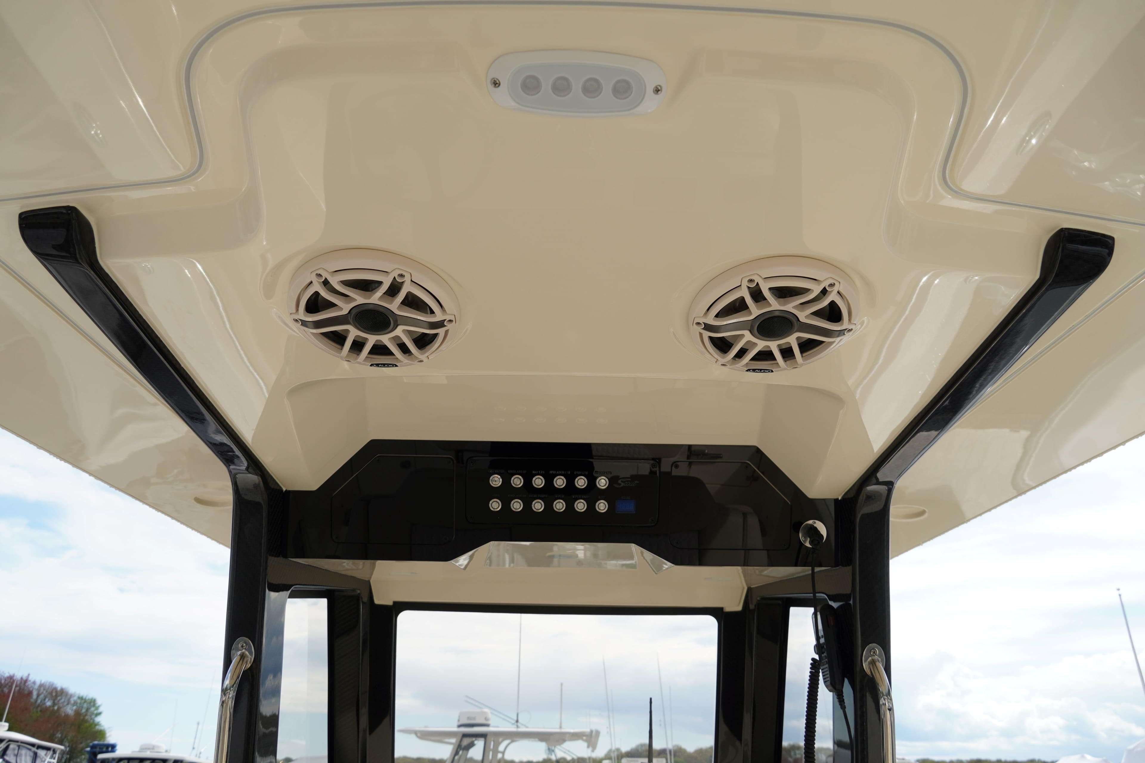 2026 Scout 288 LXF boat interior ceiling with speakers and control panel.