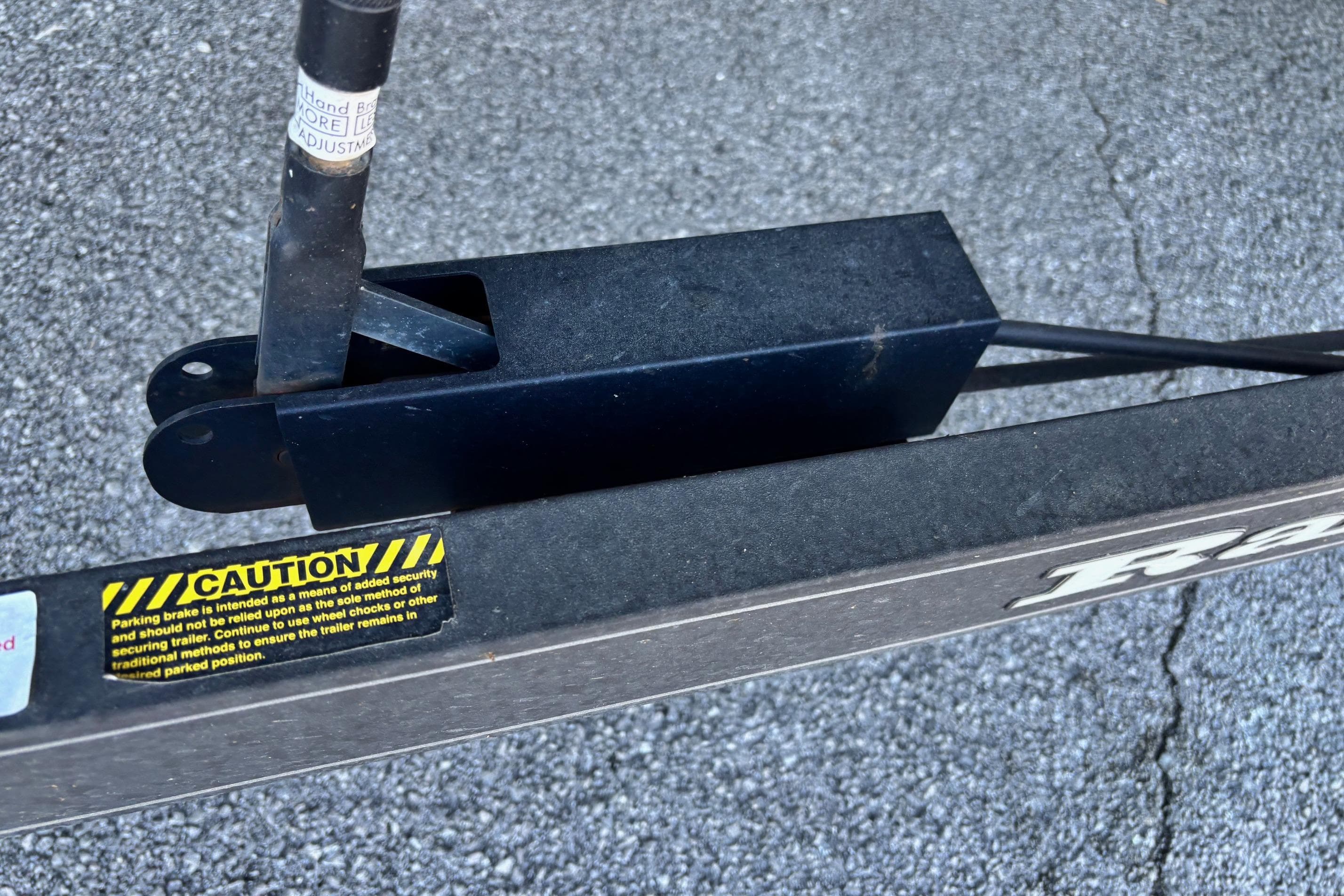 2017 Ranger Z521 Comanche trailer hitch with caution label on asphalt.