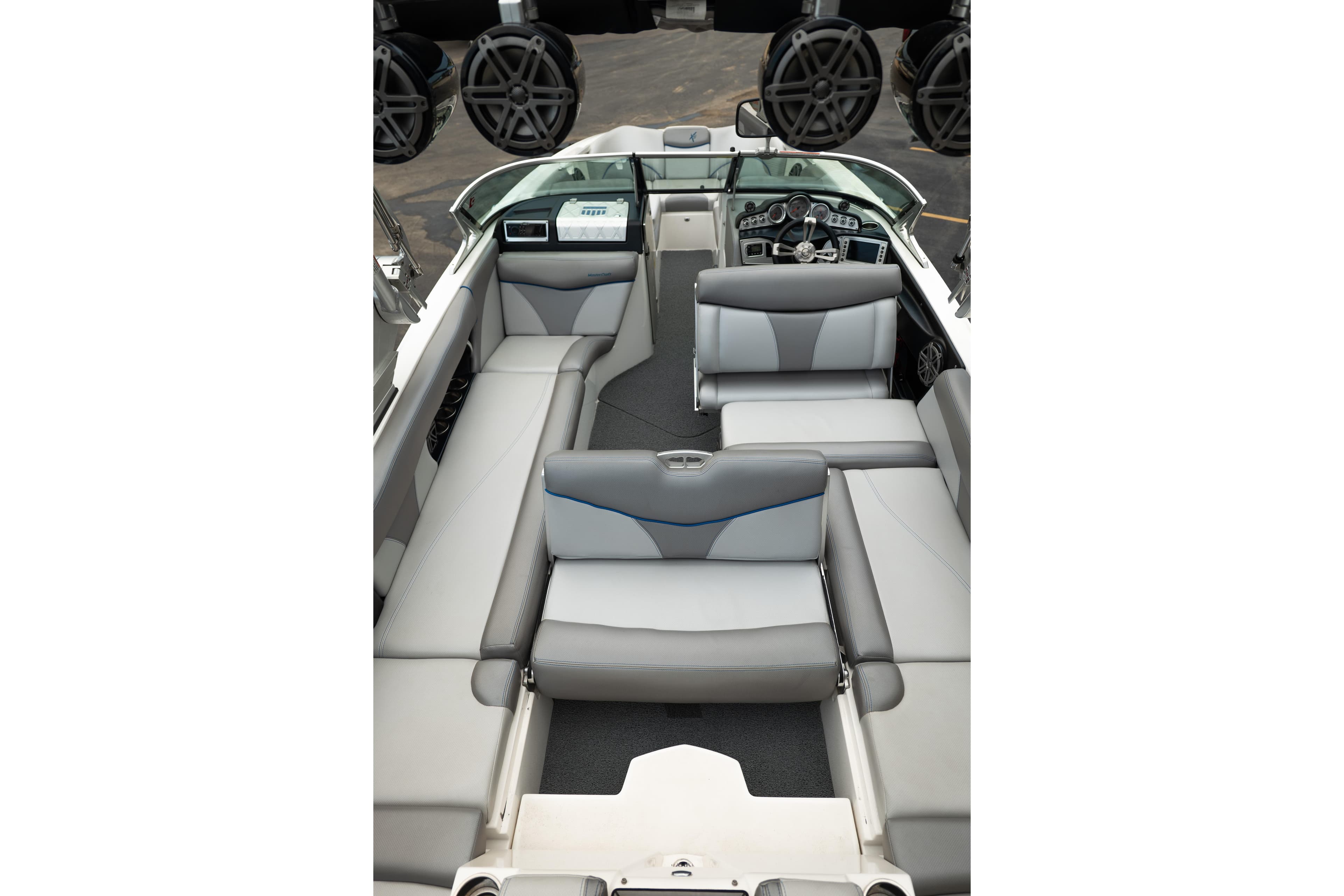 2016 MasterCraft X46 boat interior with gray seating and modern dashboard.