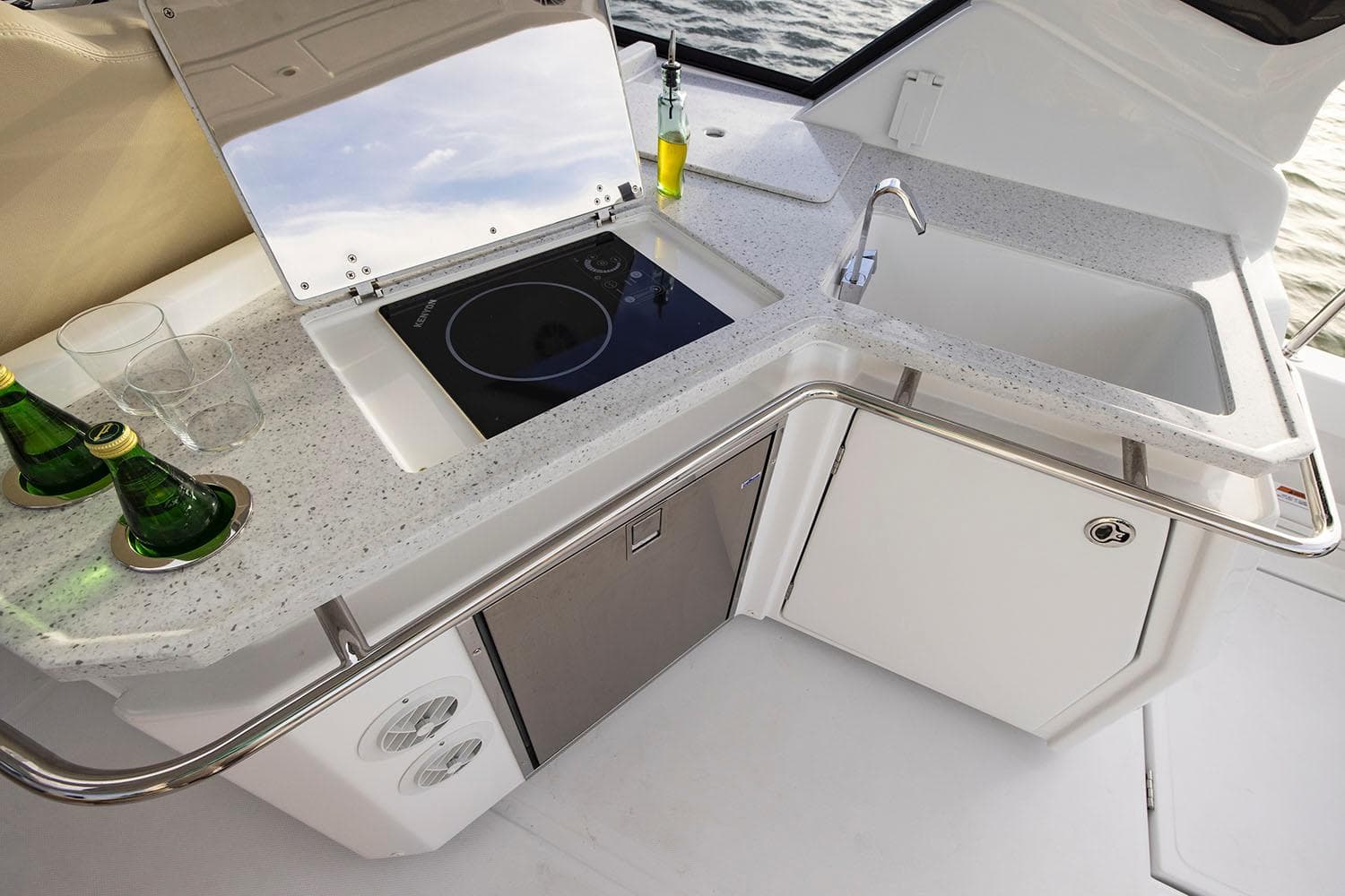 Manufacturer Provided Image: Modern kitchenette on 2026 Aquila 36 Sport yacht with sink, stove, and countertop.