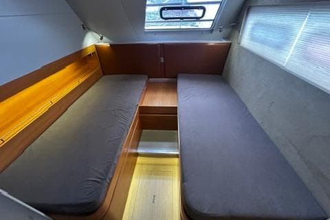 Interior of 2012 Catana 62 yacht cabin with twin beds and modern lighting.