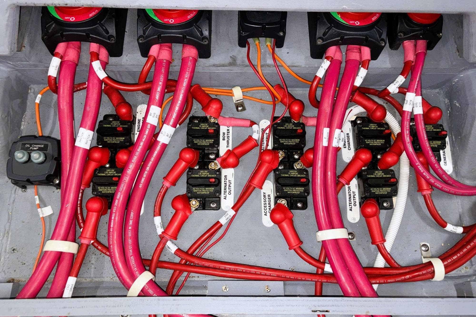Electrical wiring system in a 2016 Carver C40 boat, featuring labeled cables and switches.
