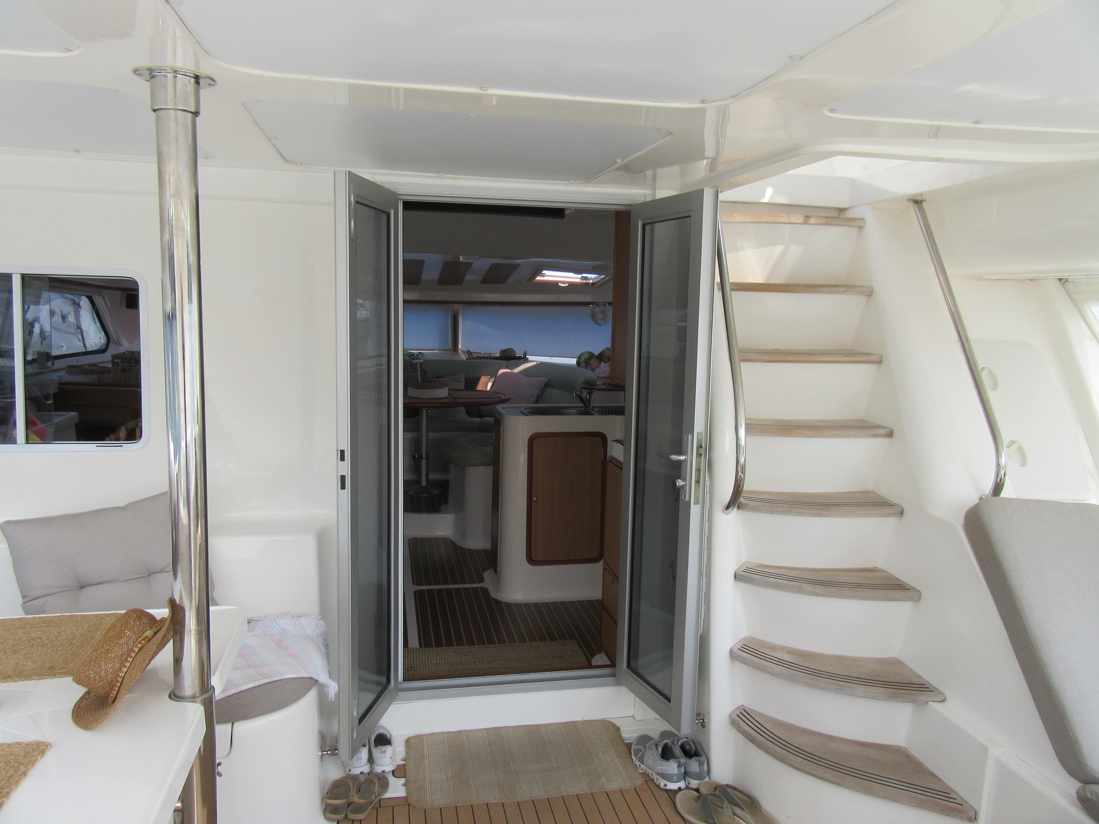 Interior view of 2008 Africat Marine 420 yacht, featuring stairs and open doors.