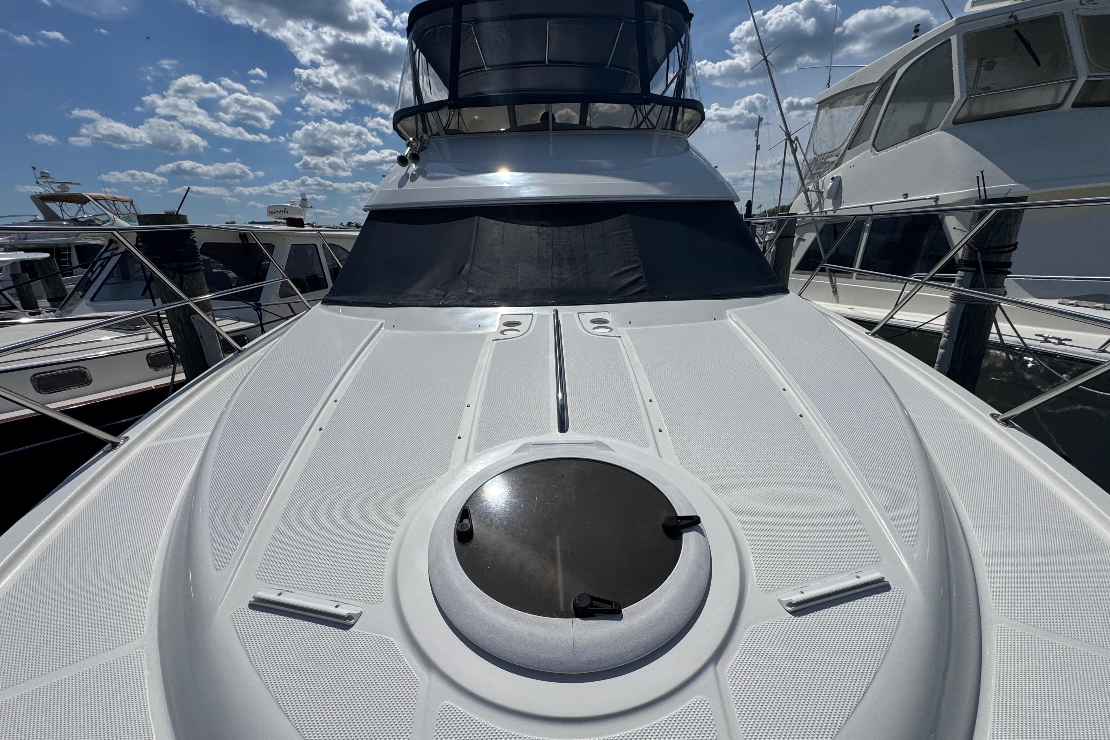2006 Meridian 459 Motoryacht deck view under a partly cloudy sky.