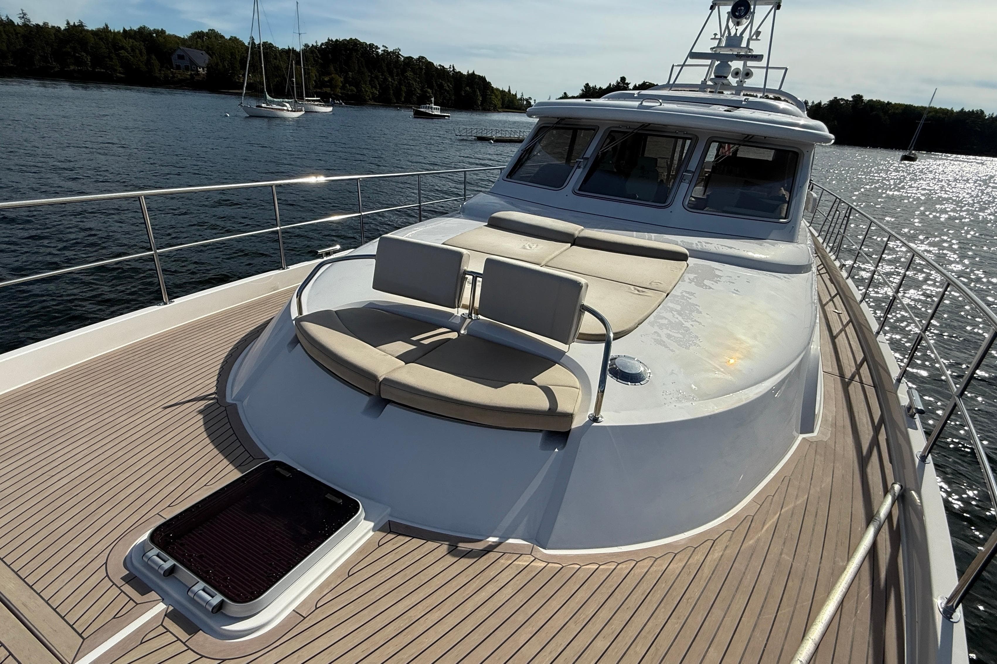 Luxurious 2021 Elling E6 yacht with spacious deck and scenic water view.