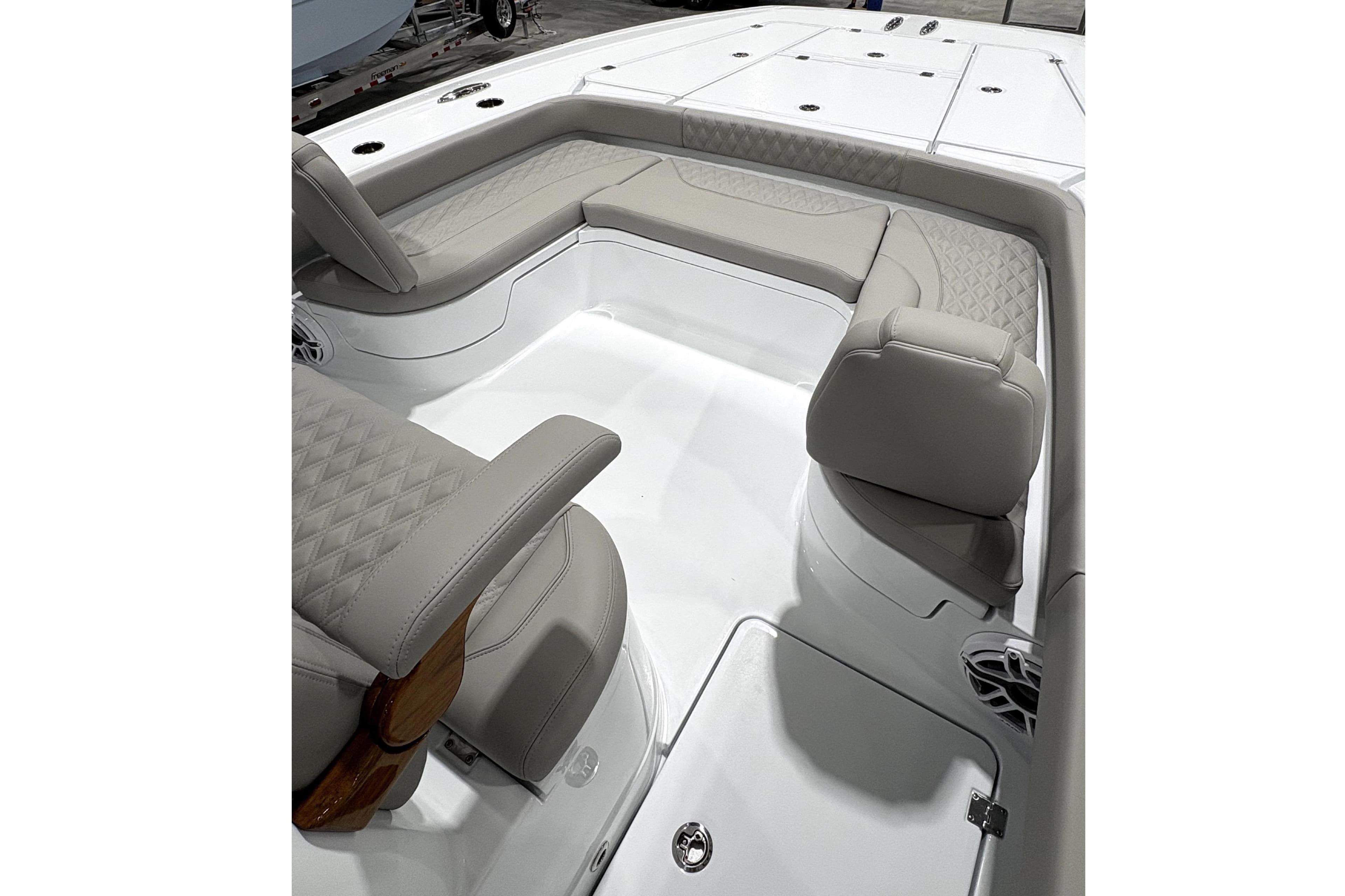 Interior of Freeman 28 boat, 2026 model, featuring cushioned seating.