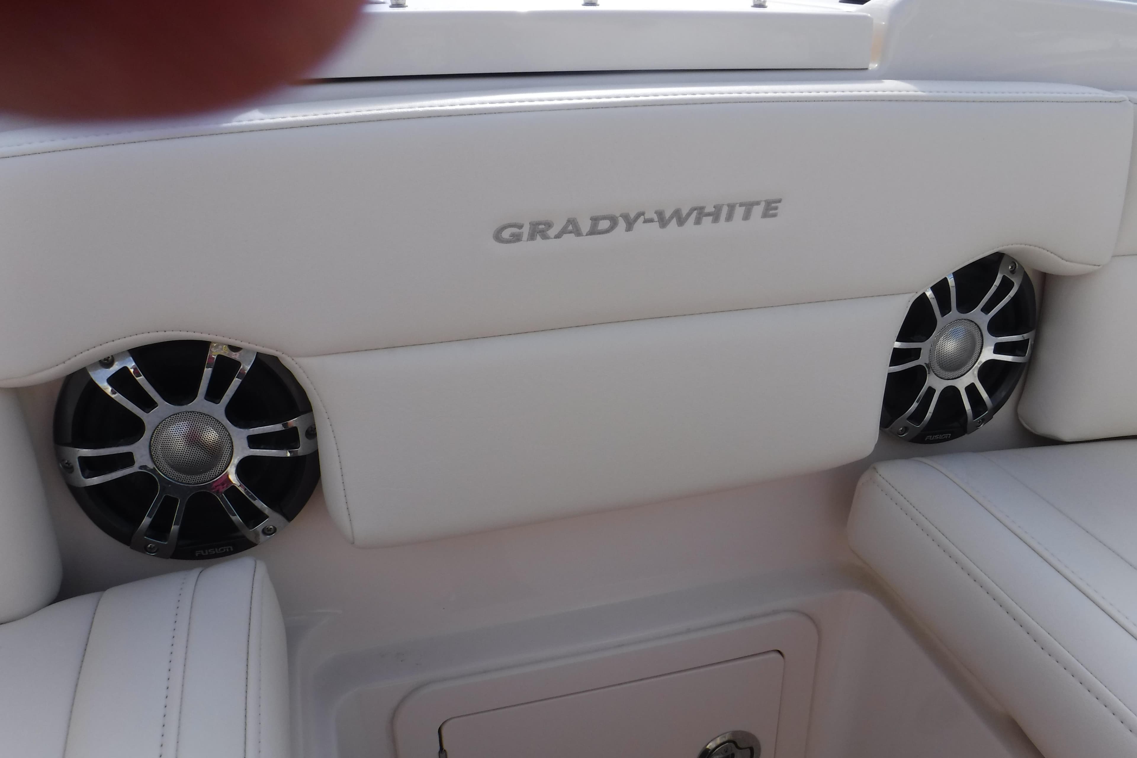 2020 Grady-White Freedom 285 boat interior with speakers and white seating.
