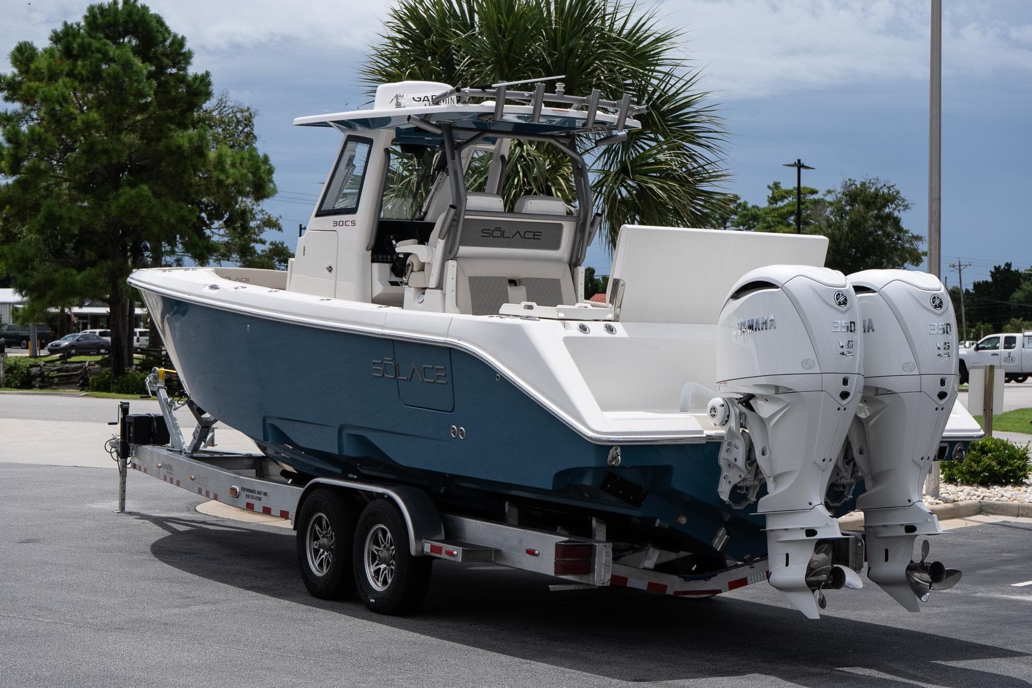 2026 Solace 30 CS boat on trailer with twin Yamaha engines, parked outdoors.