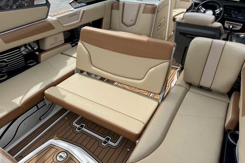 2019 Nautique Super Air Nautique G23 interior with beige and brown seating.