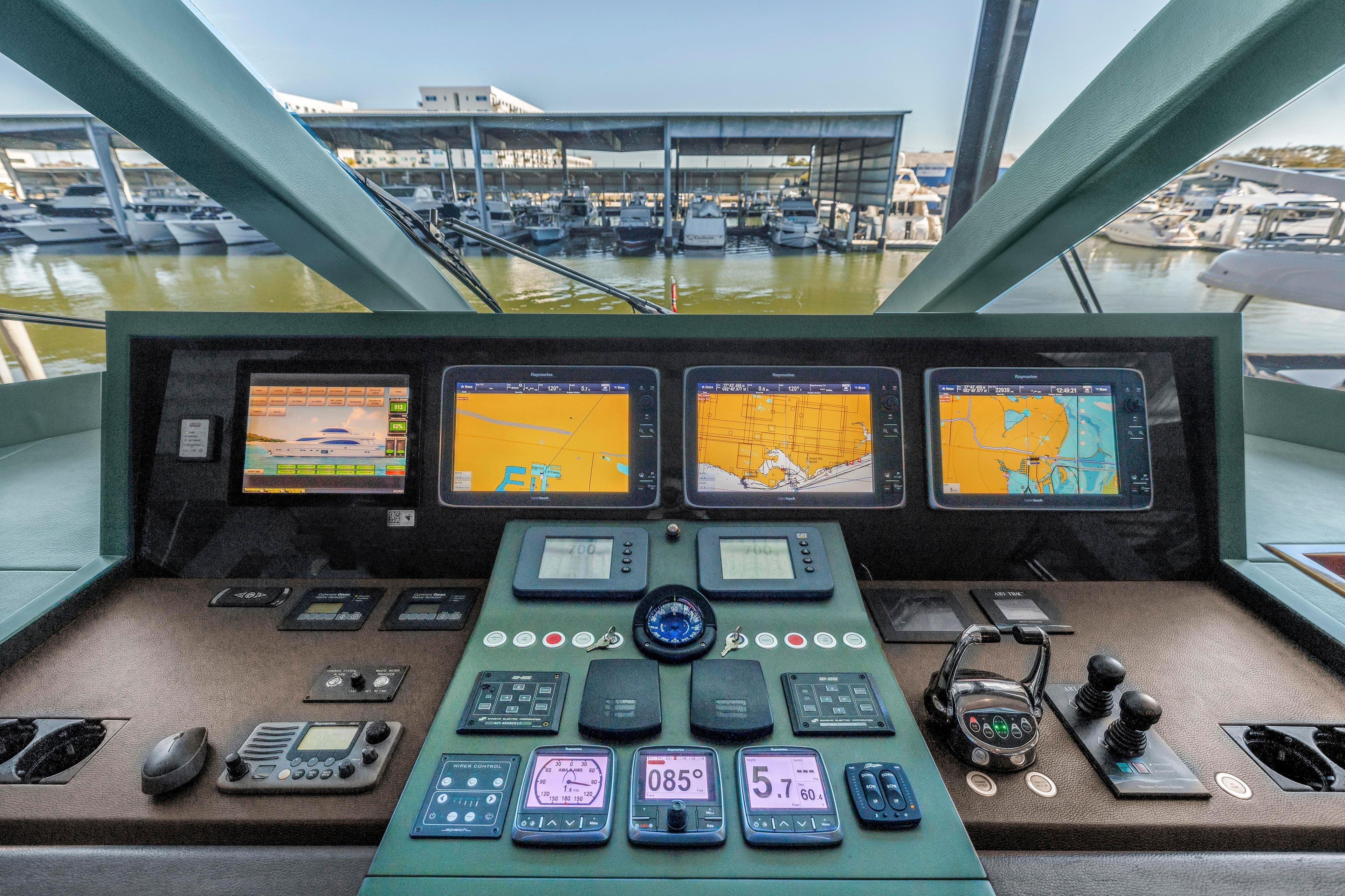 Control panel of a 2015 Horizon E88 yacht with navigation screens and controls.
