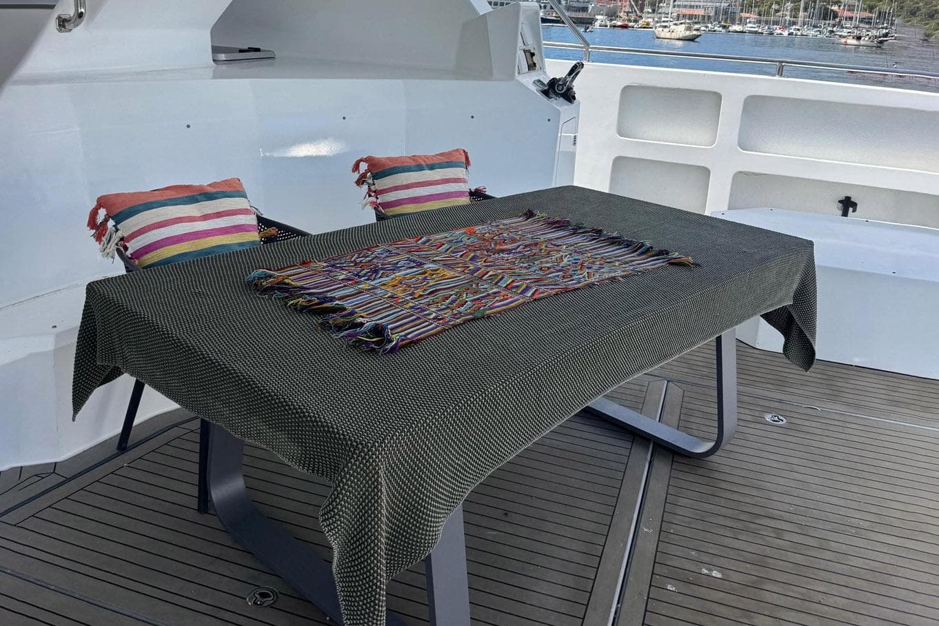Leeuwin 55 yacht deck with table and cushions, 2024 model.