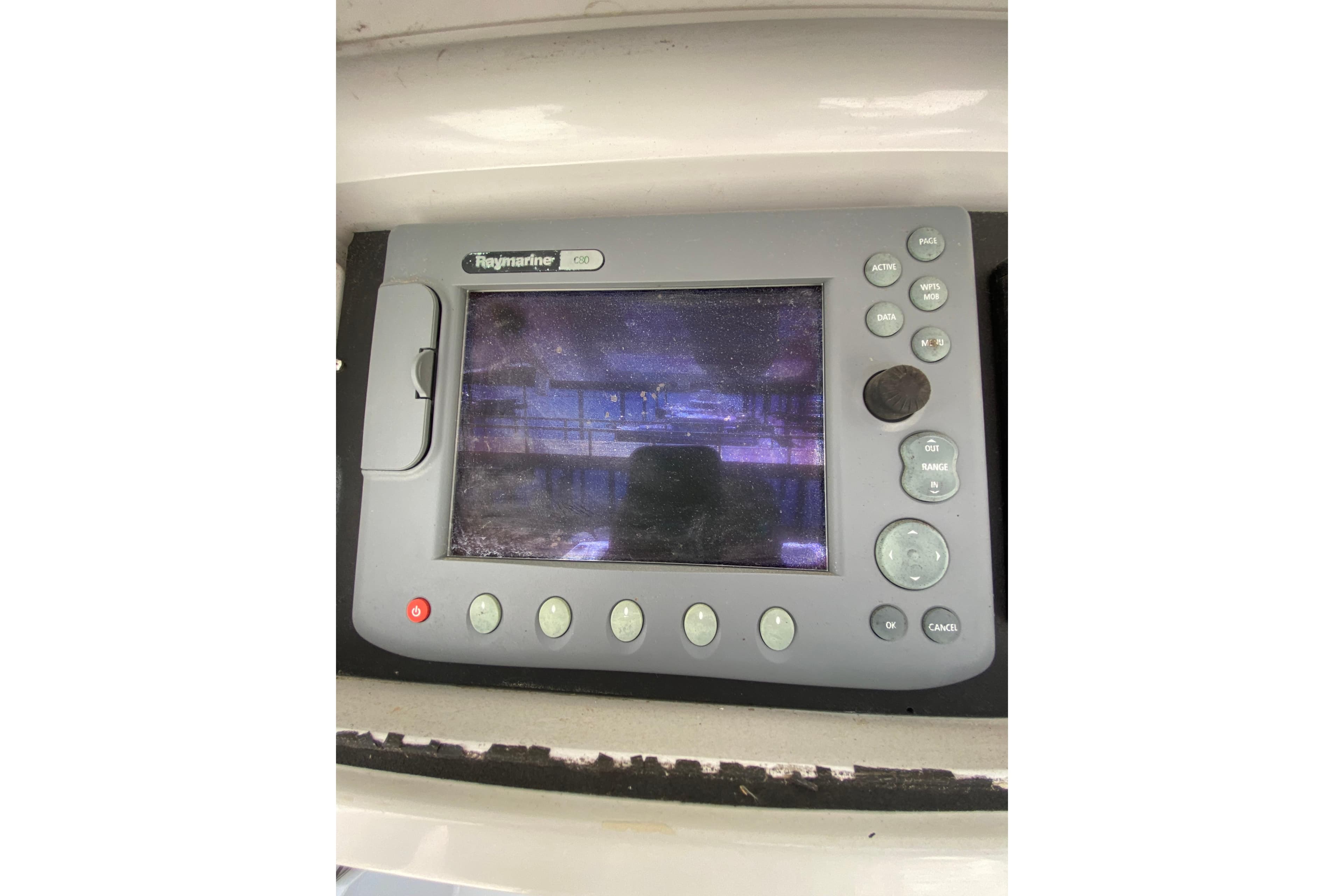 Raymarine navigation display on a 1996 Intrepid 337 boat dashboard.