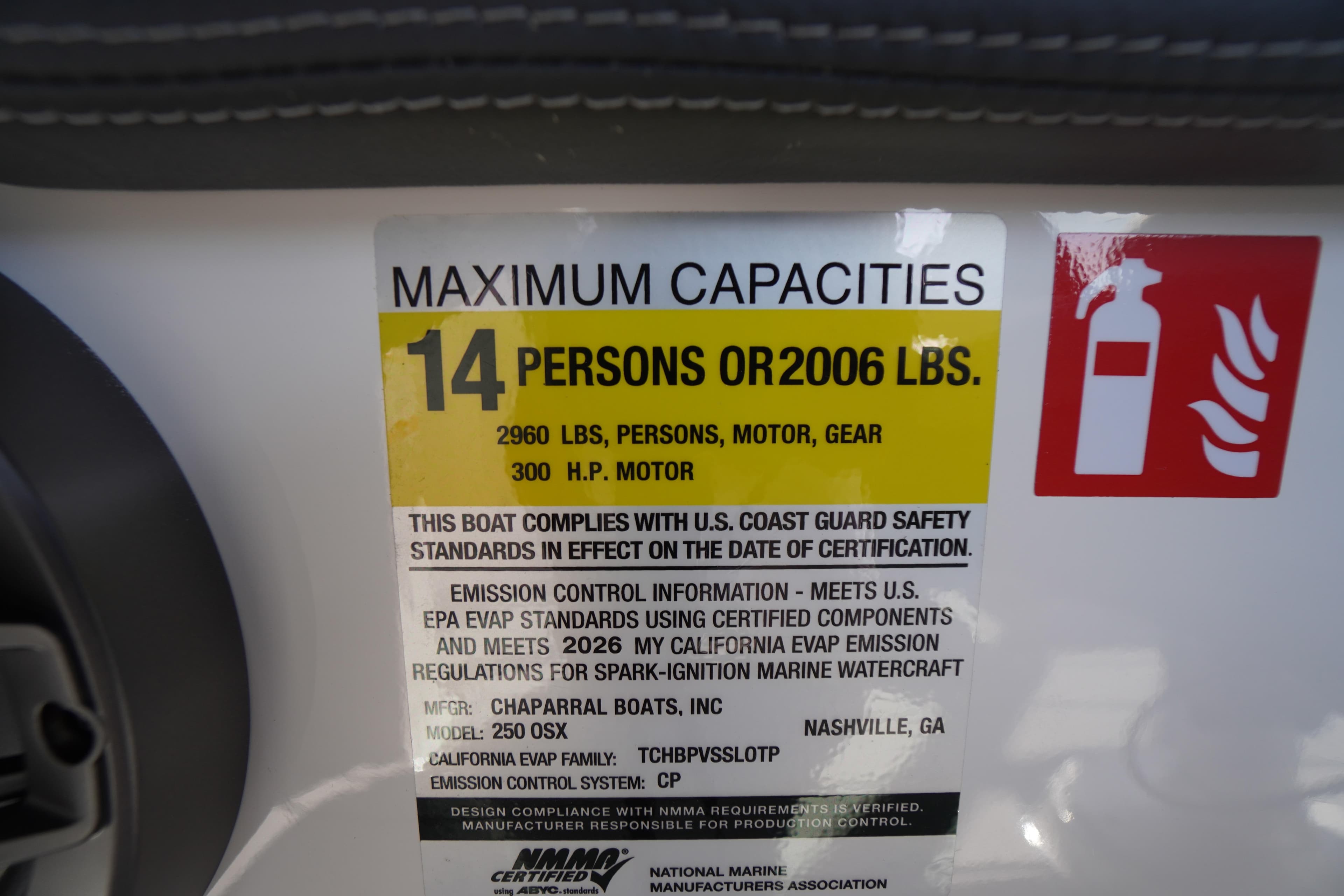 2026 Chaparral 250 OSX capacity label: 14 persons, 2960 lbs, 300 HP motor.