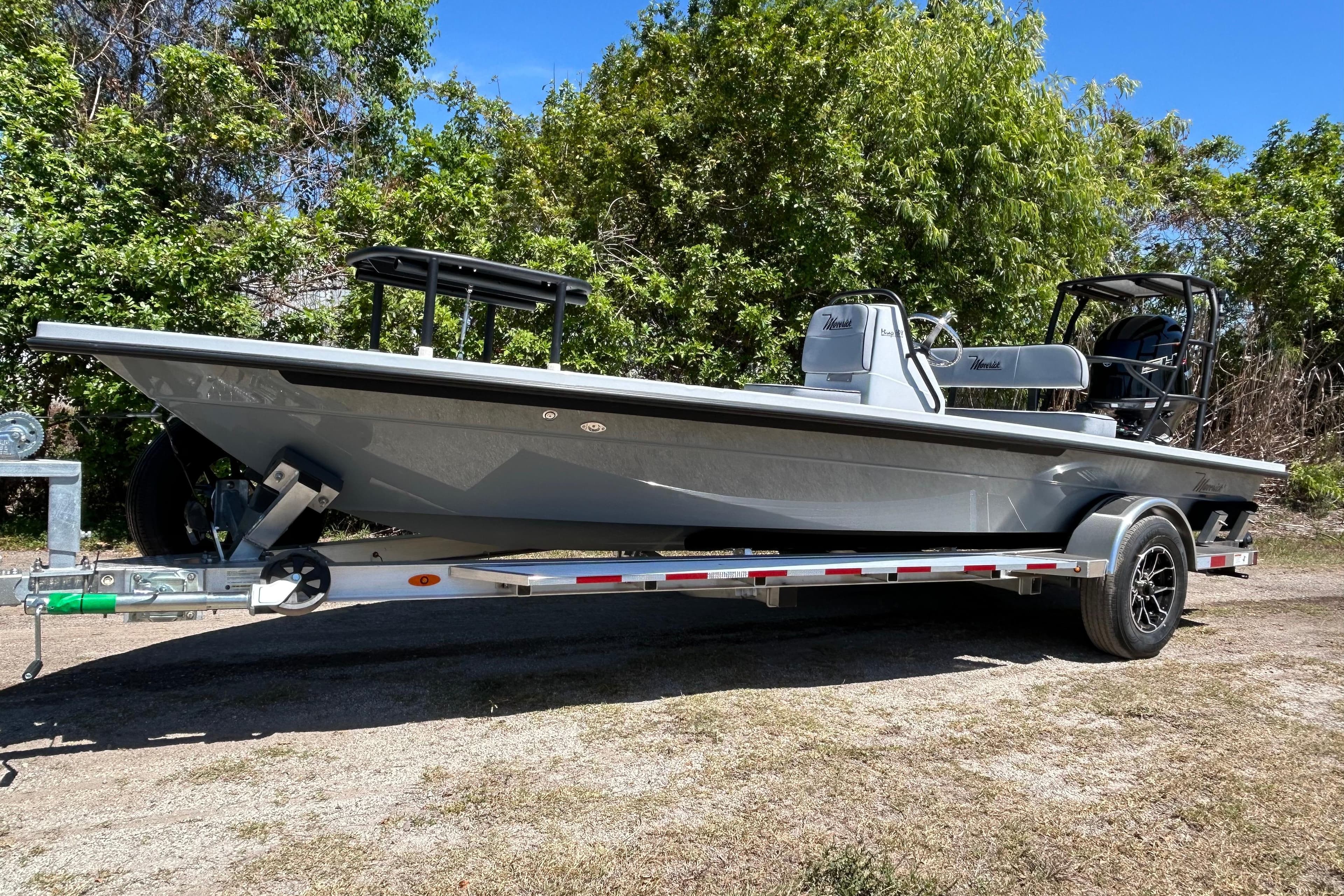 2026 Maverick 18 HPX-V boat on trailer, parked outdoors with trees in background.