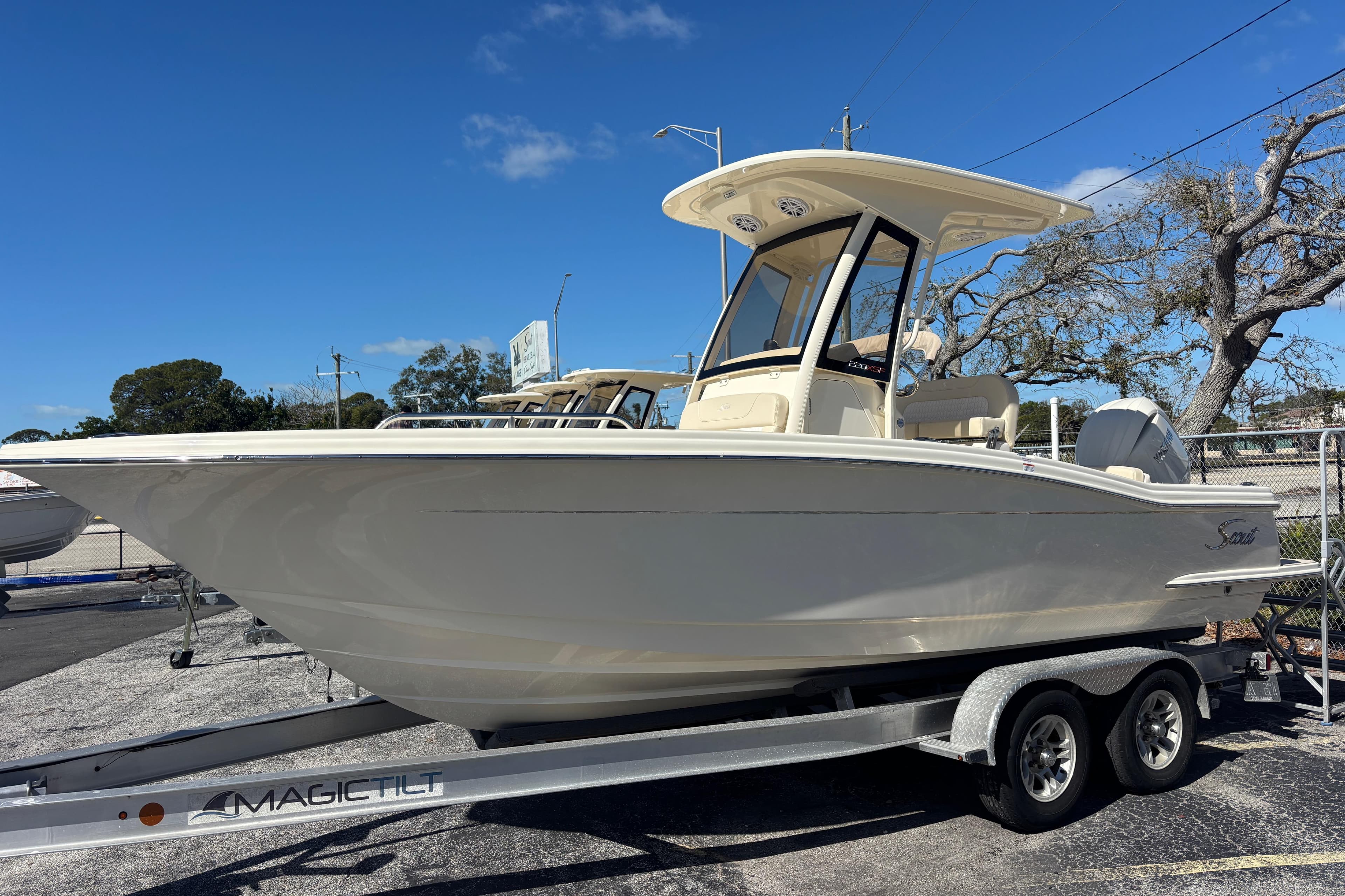 2026 Scout 220 XSF boat on trailer under clear blue sky.