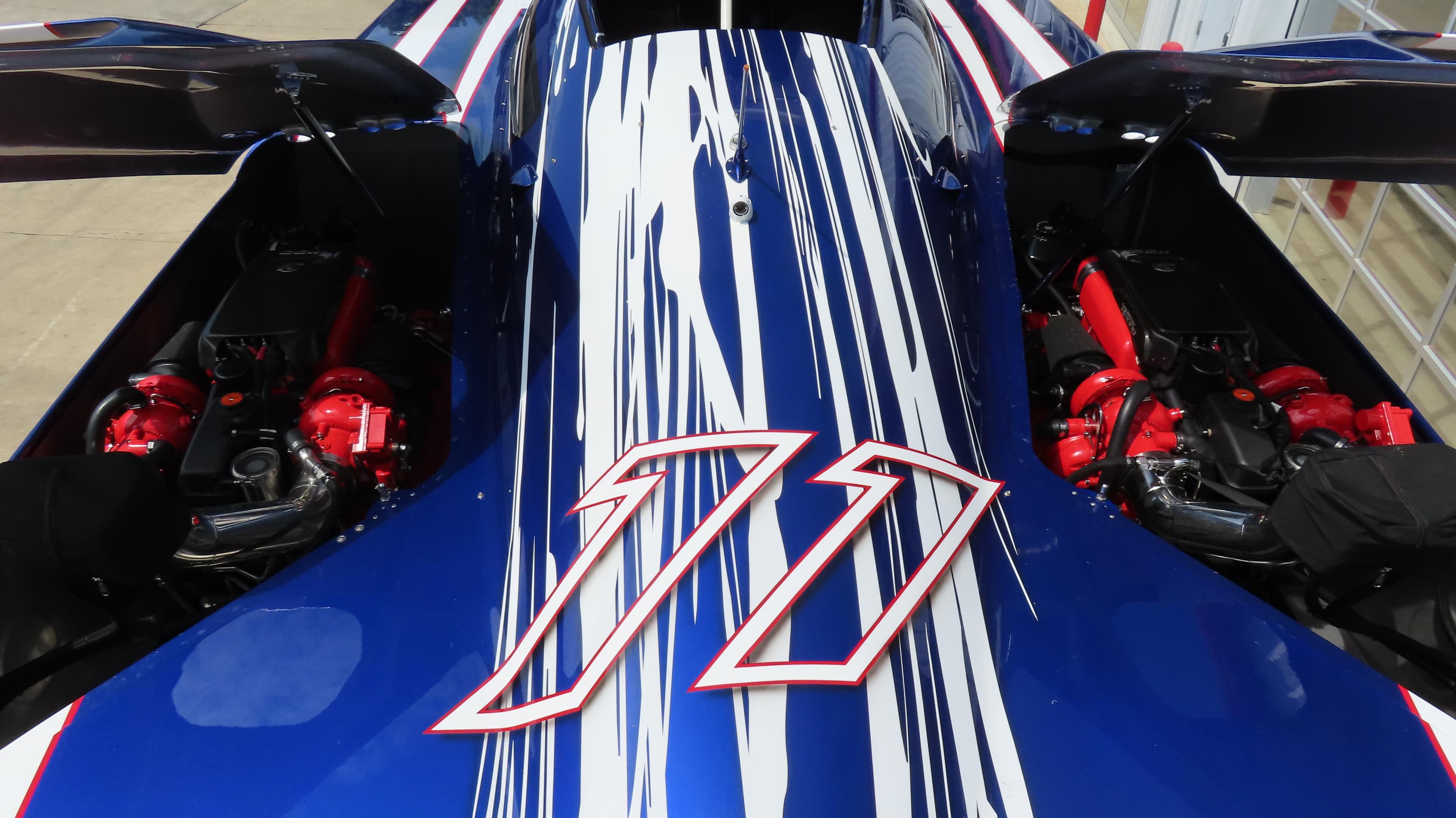 2007 Mystic Powerboats 50' with striking blue and white design, showcasing powerful engines.