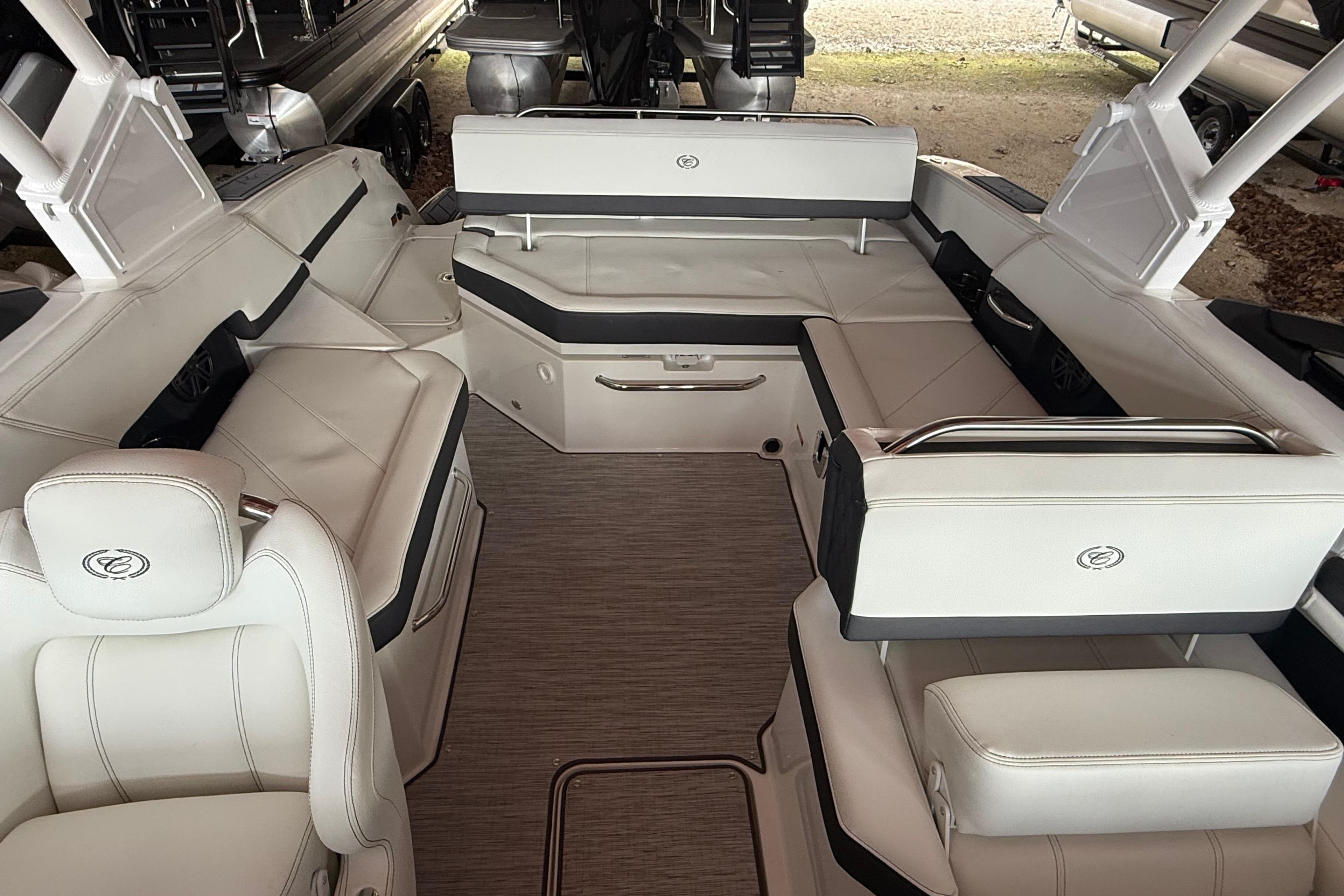 Luxurious interior of 2025 Cobalt R6 boat with elegant white seating and modern design.