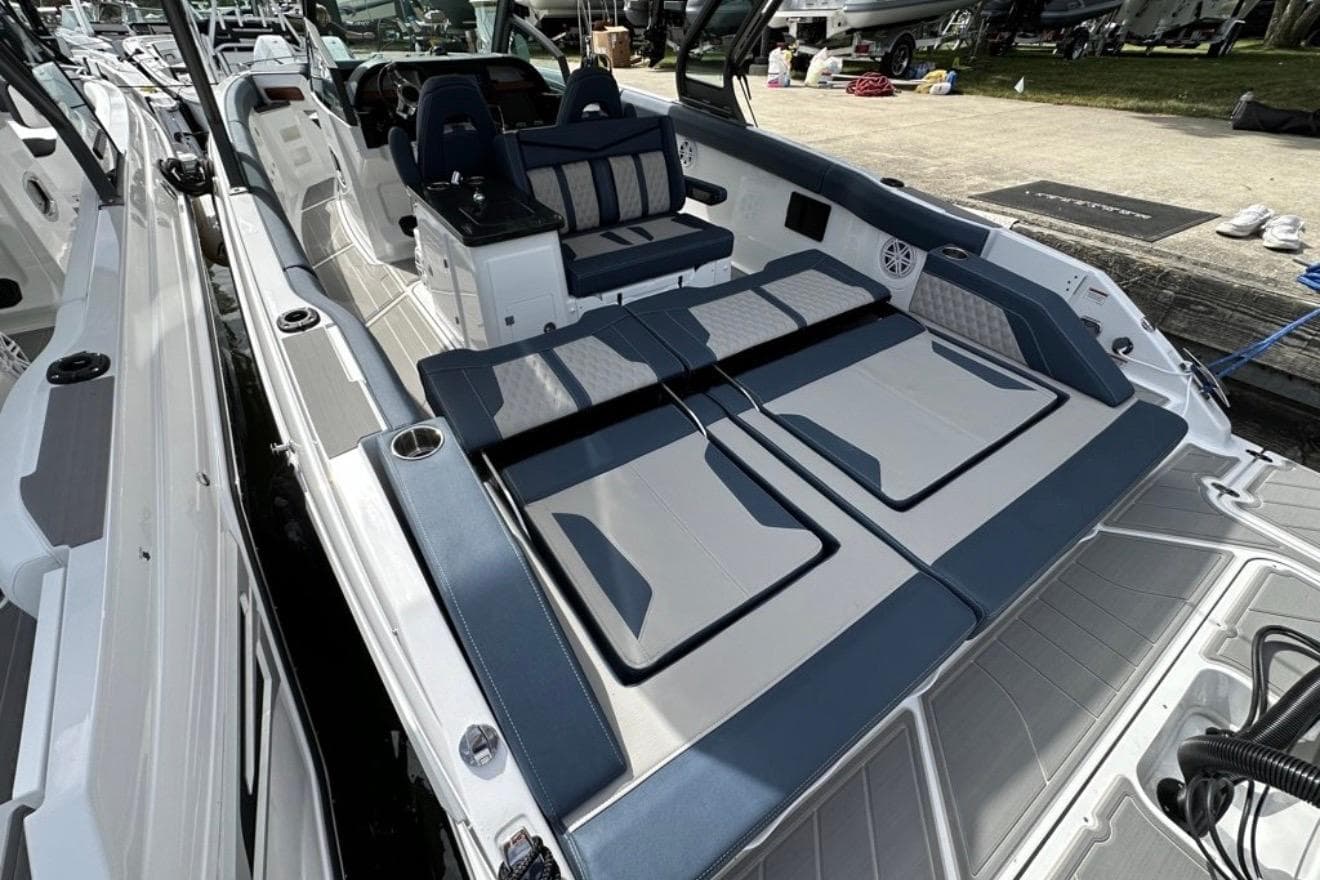 2025 Monterey Elite 30 OB boat interior with luxurious seating and modern design.