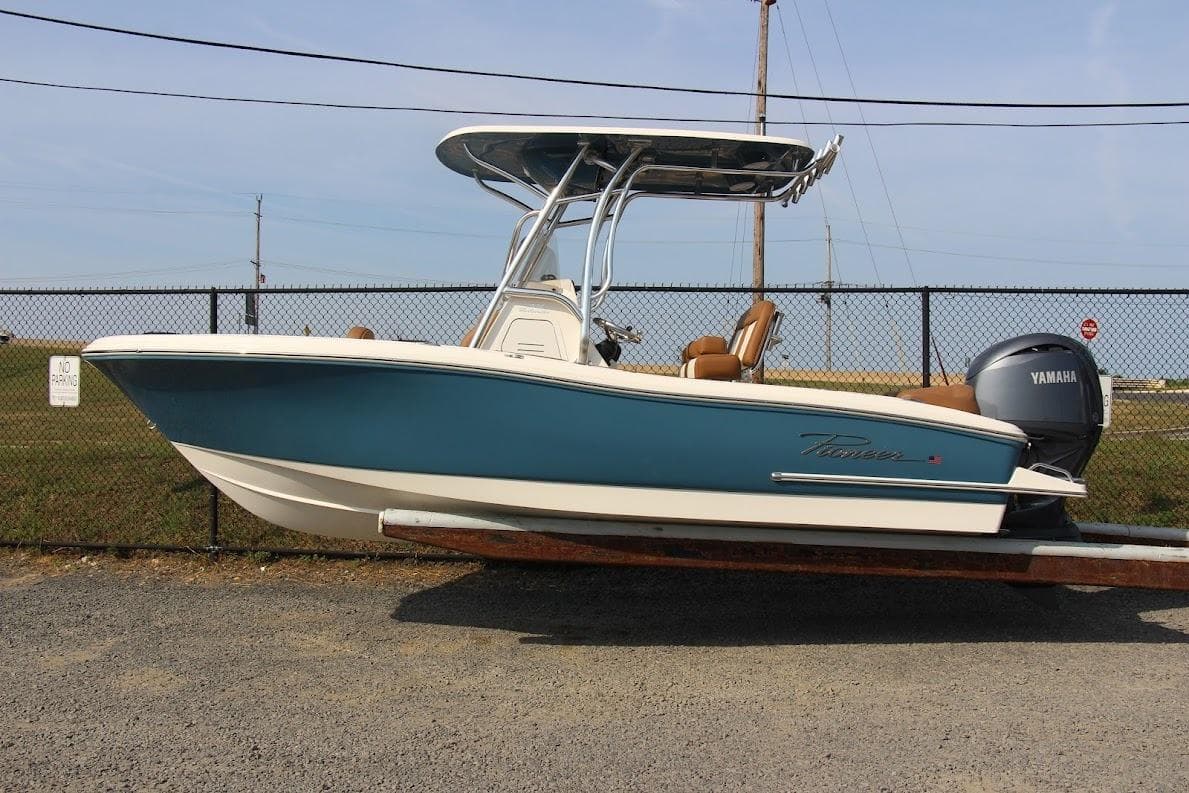 2025 Pioneer 202 Islander boat with Yamaha engine, parked on a trailer.